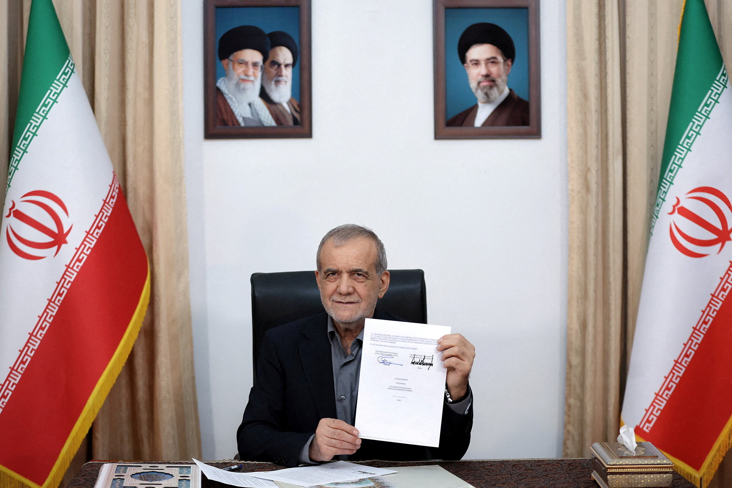 Iranian President Masoud Pezeshkian shows the document of U.S. Memorandum of Understanding in Tehran, Iran, June 18, 2026. Iran's Presidential website/WANA (West Asia News Agency)/Handout via REUTERS ATTENTION EDITORS - THIS PICTURE WAS PROVIDED BY A THIRD PARTY. ISRAEL OUT. NO COMMERCIAL OR EDITORIAL SALES IN ISRAEL. NO ACCESS FOR ISRAELI MEDIA. NO USE BBC PERSIAN. NO USE VOA PERSIAN. NO USE MANOTO. NO USE IRAN INTERNATIONAL. NO USE RADIO FARDA. DIGITAL: NO USE BBC PERSIAN. NO USE VOA PERSIAN. NO USE MANOTO. NO USE IRAN INTERNATIONAL. NO USE RADIO FARDA. BLURRING FROM SOURCE. TPX IMAGES OF THE DAY