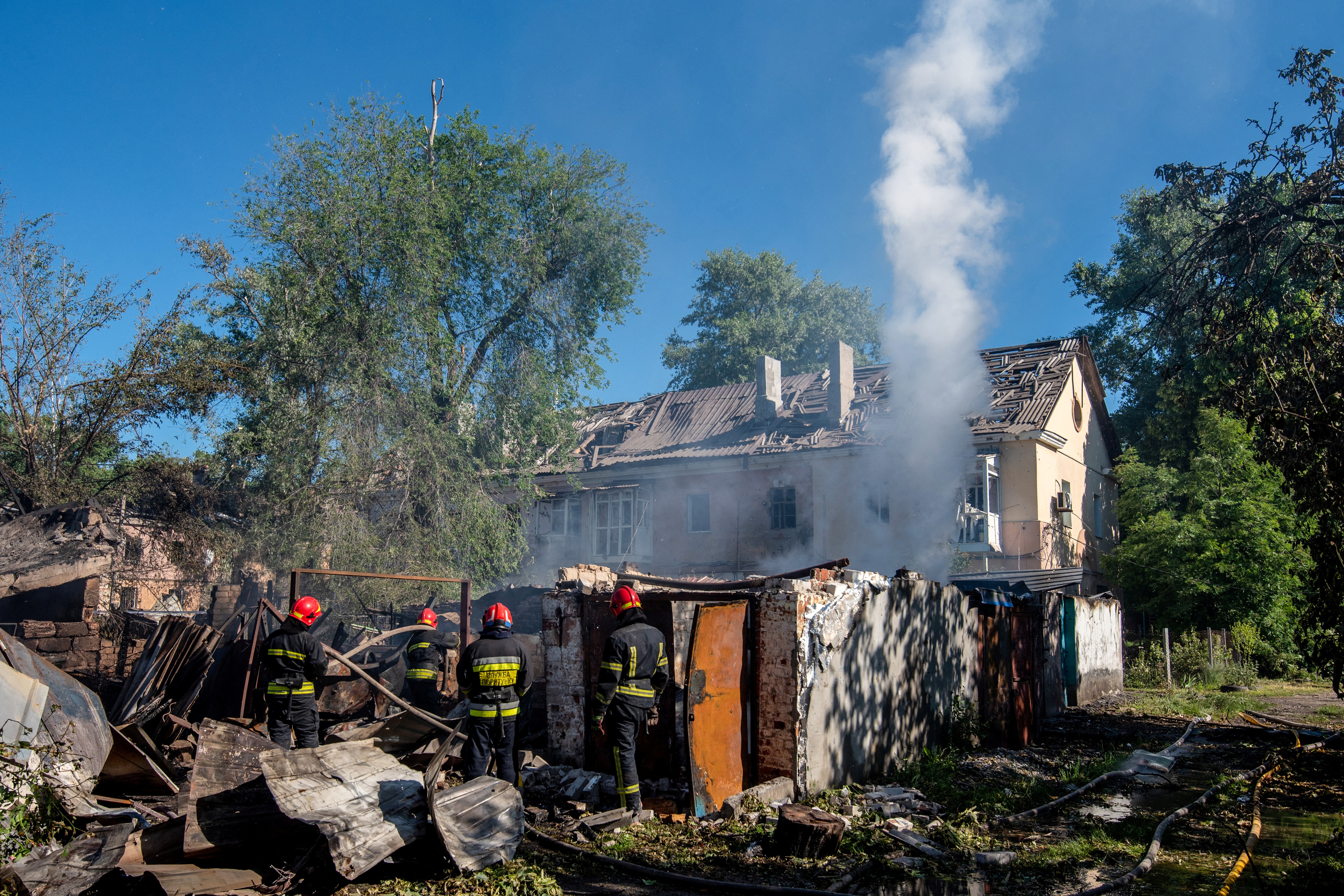 Ukrainian rescuers work by a damaged building following an air attack in Dnipro on June 2, 2026, amid the Russian invasion of Ukraine.