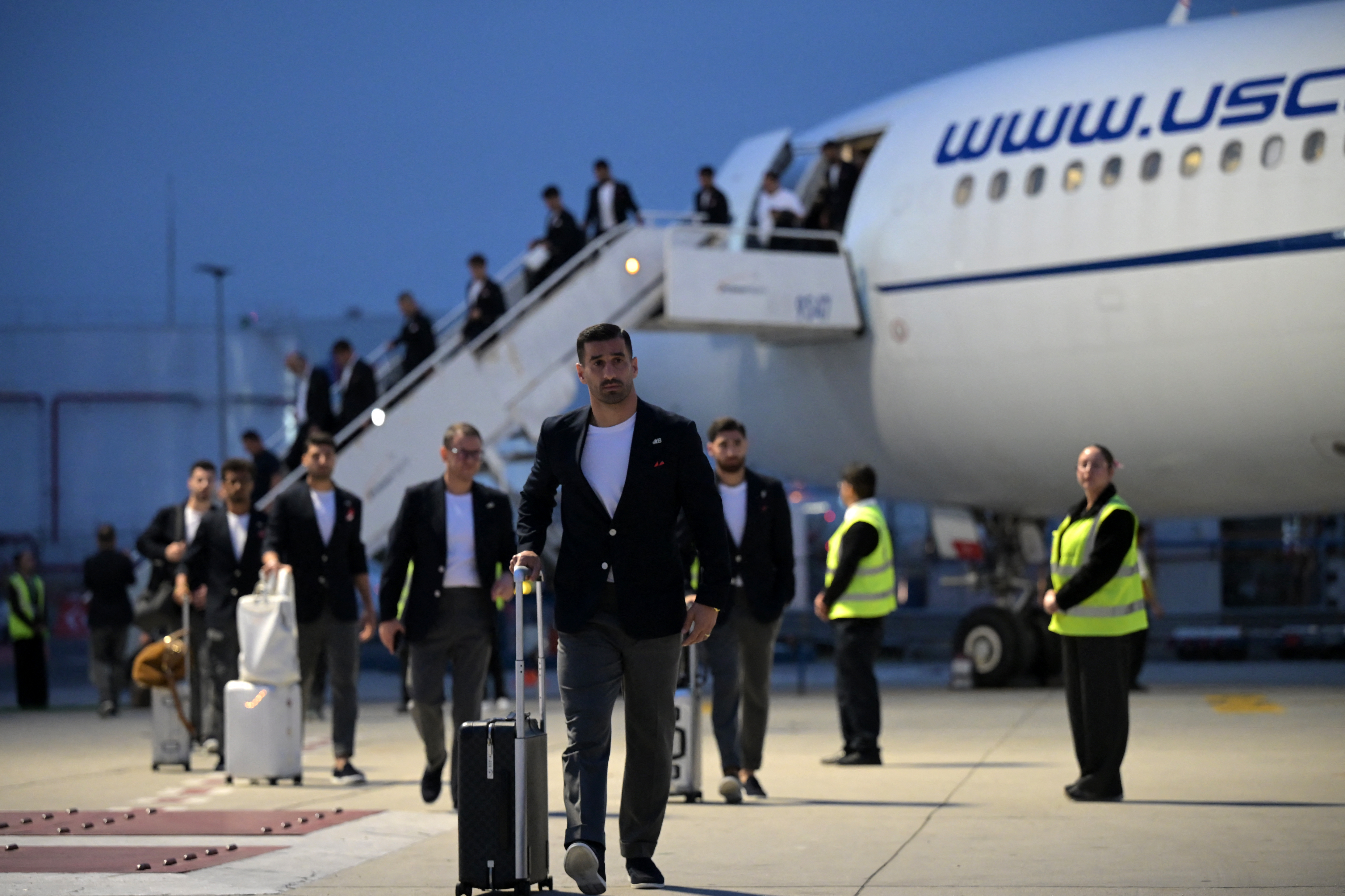 Iran's captain and defender Ehsan Haji Safi and teammates walk on the tarmac on arrival at the Tijuana International Airport in Tijuana, Mexico on June 7, 2026, ahead of the FIFA 2026 World Cup football tournament. (Photo by Guillermo Arias / AFP)
