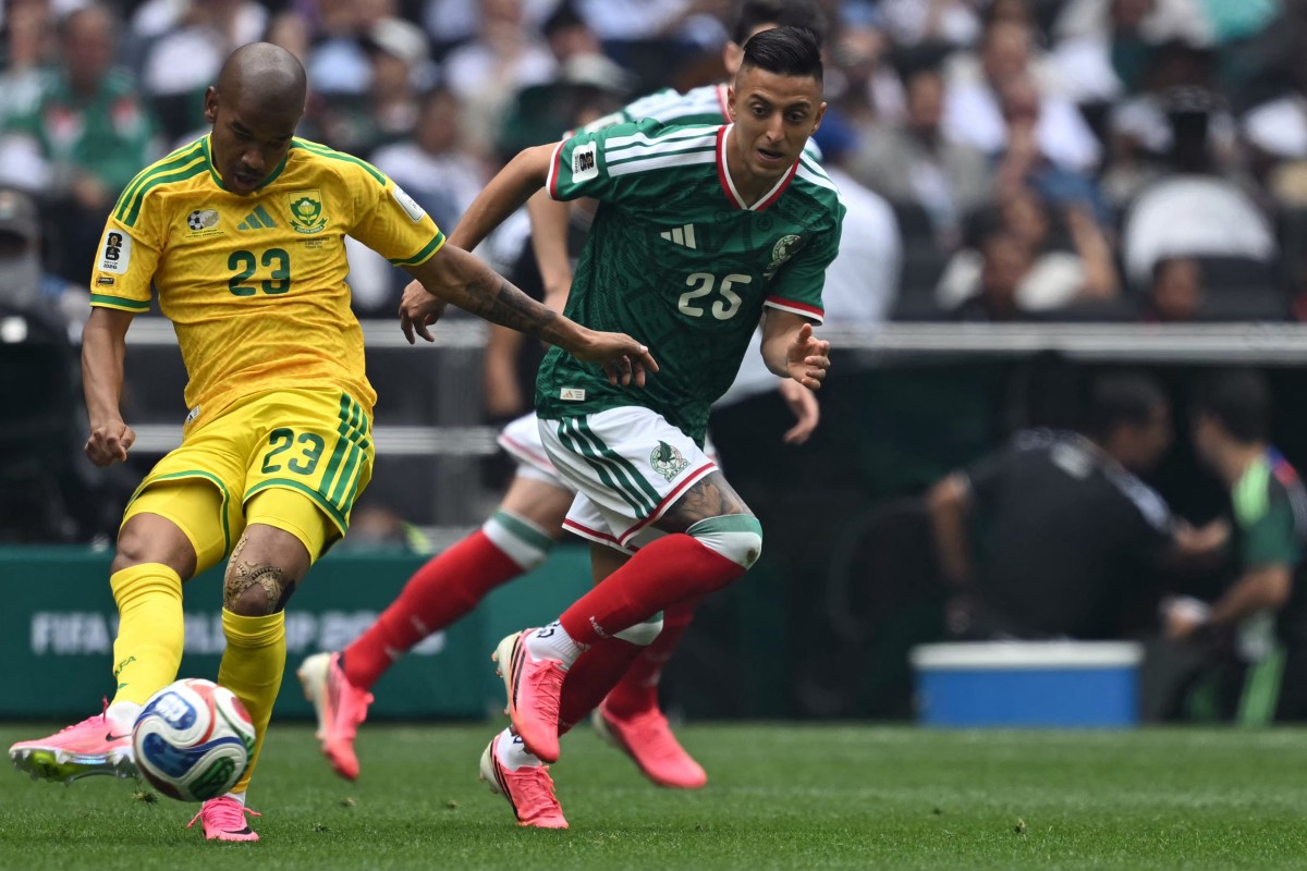 South Africa's midfielder #23 Jayden Adams and Mexico's midfielder #25 Roberto Alvarado fight for the ball during the 2026 World Cup Group A football match