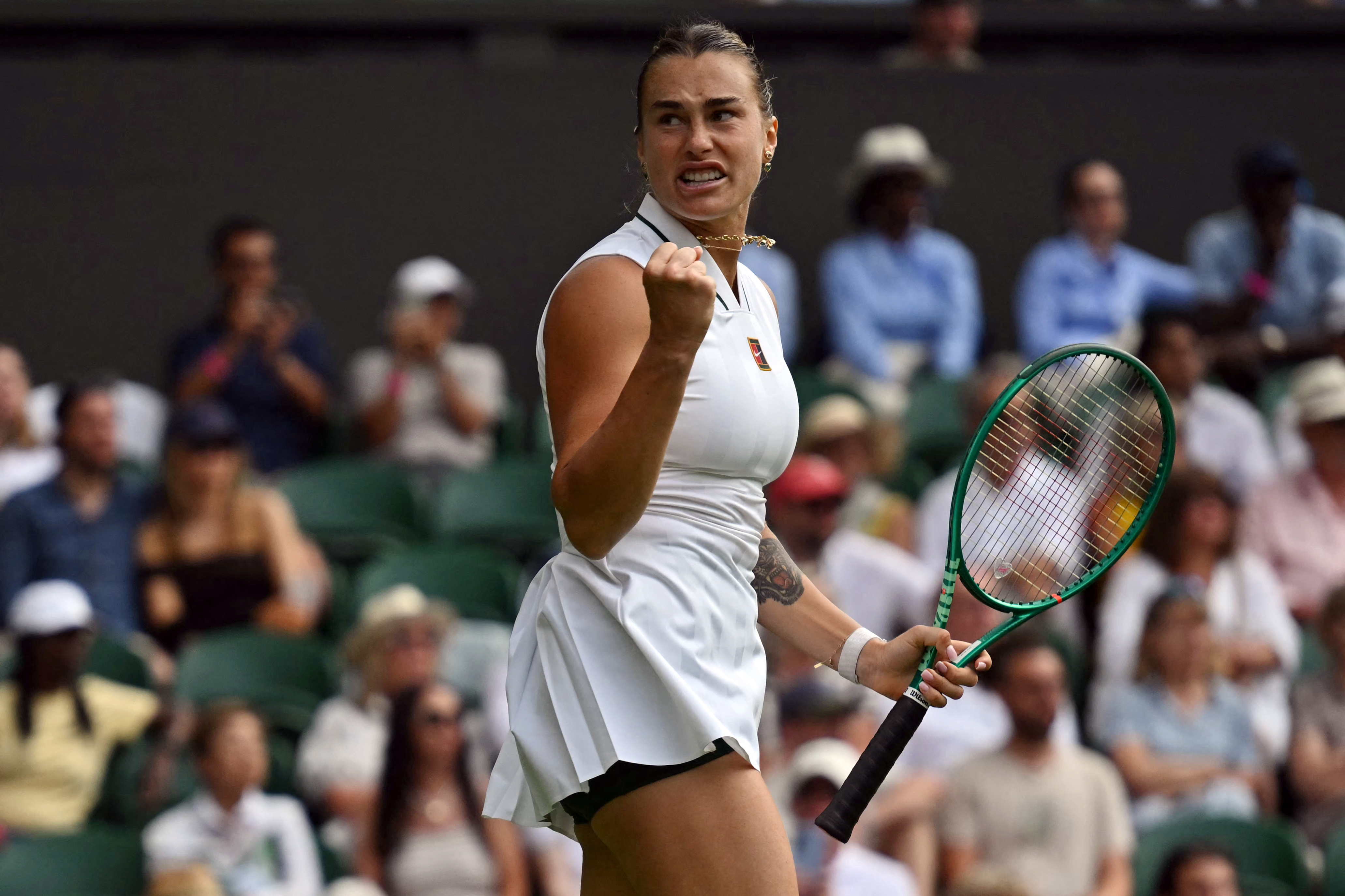 Belarus's Aryna Sabalenka celebrates beating Serbia's Teodora Kostovic during their women's singles first round tennis match on the first day of the 2026 Wimbledon Championships at The All England Lawn Tennis and Croquet Club in Wimbledon, southwest London, on June 29, 2026. (Photo by Glyn KIRK / AFP) / RESTRICTED TO EDITORIAL USE