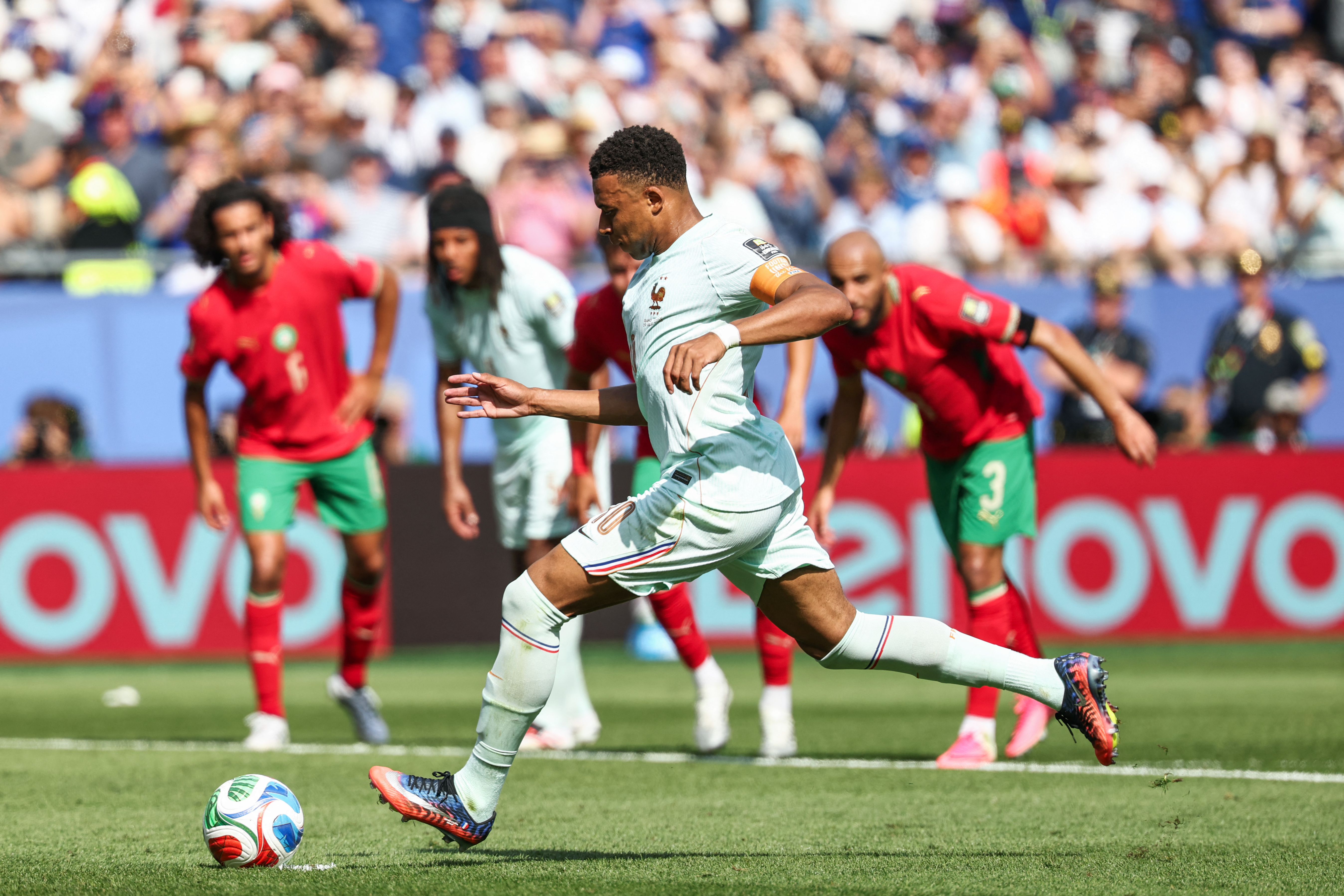 Kylian Mbappe takes a penalty.