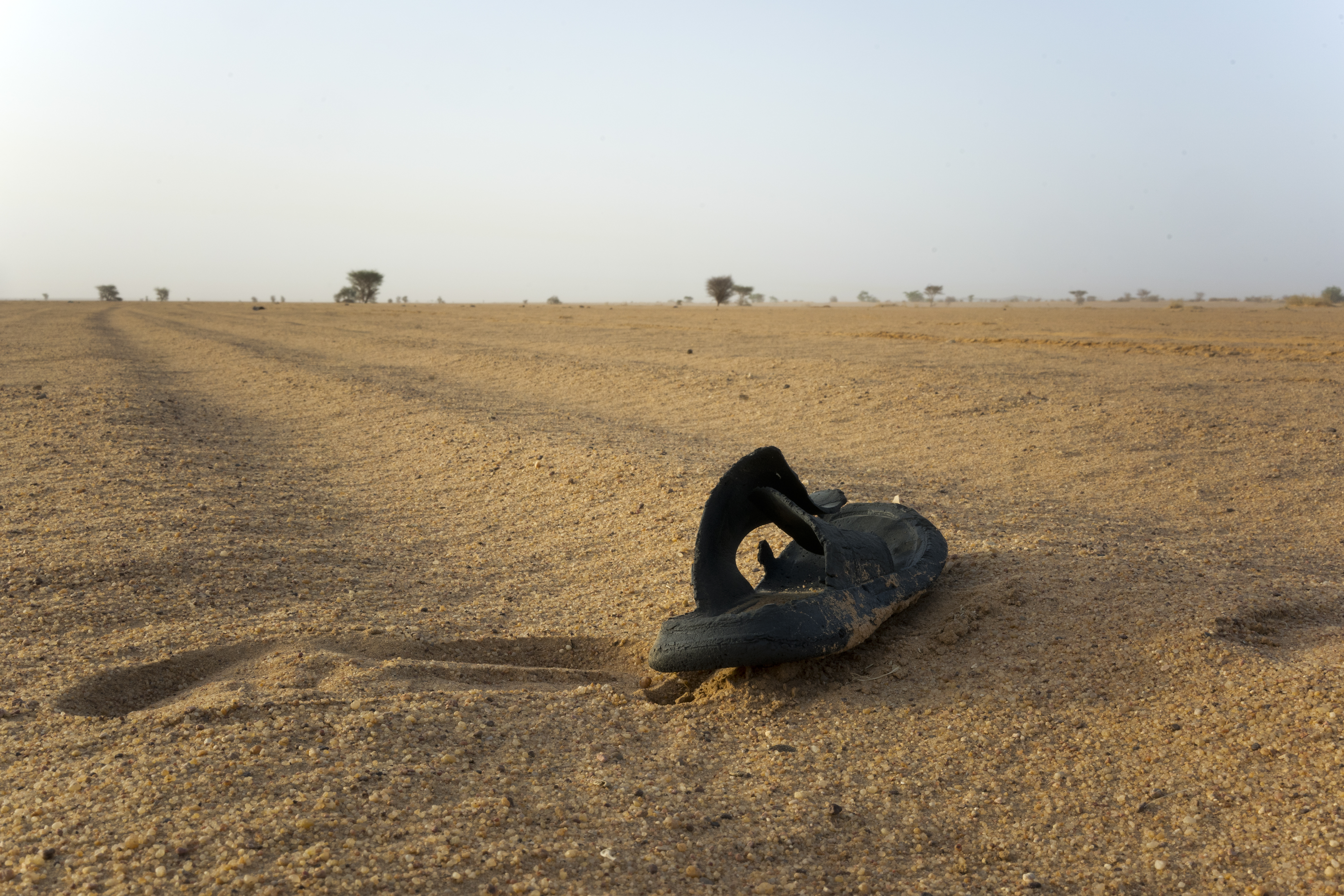 A sandal lies on the ground in Niger's Tenere desert region of the south central Sahara on June 3, 2018.