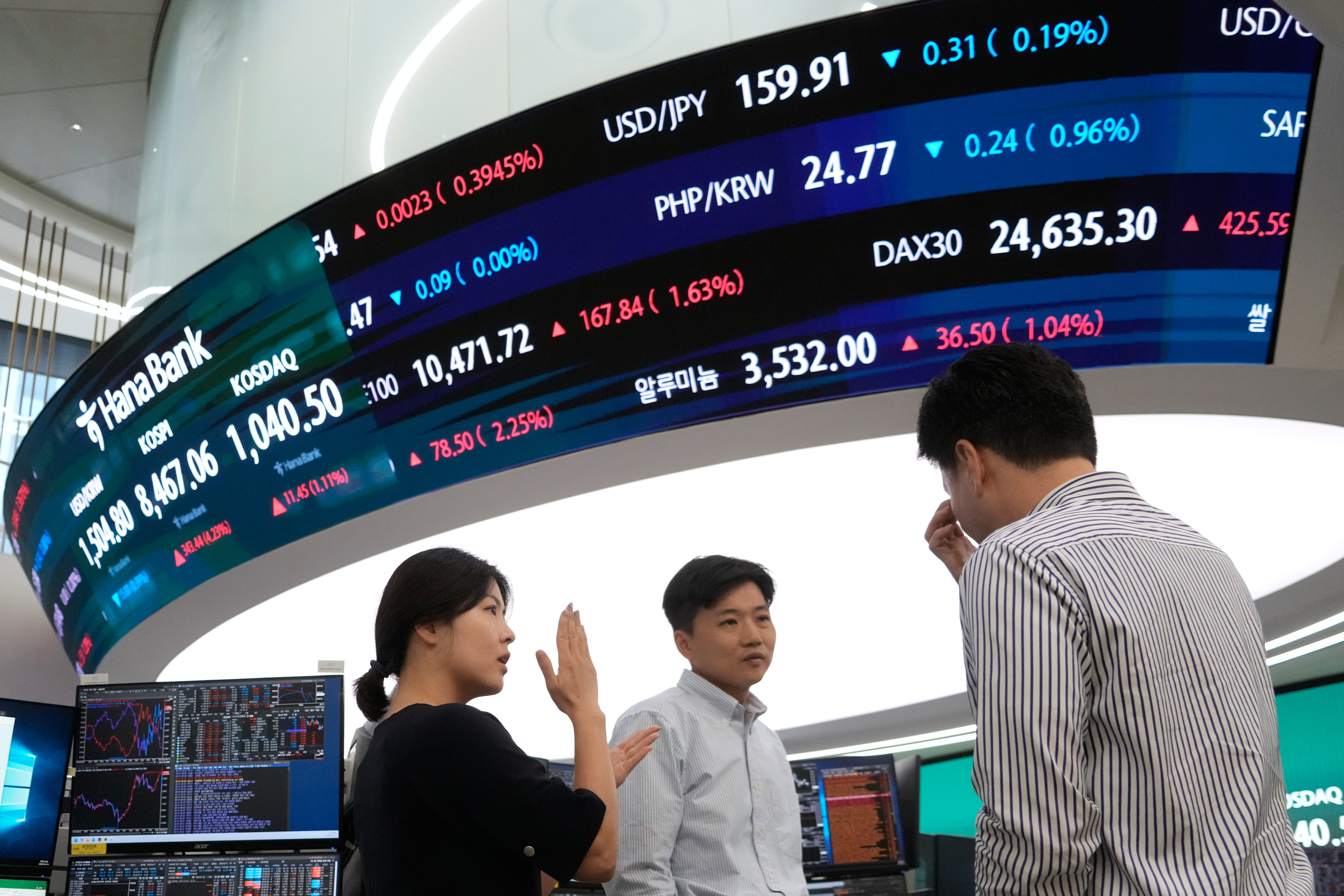Currency traders work at the foreign exchange dealing room of the Hana Bank headquarters in Seoul, South Korea, on June 15, 2026