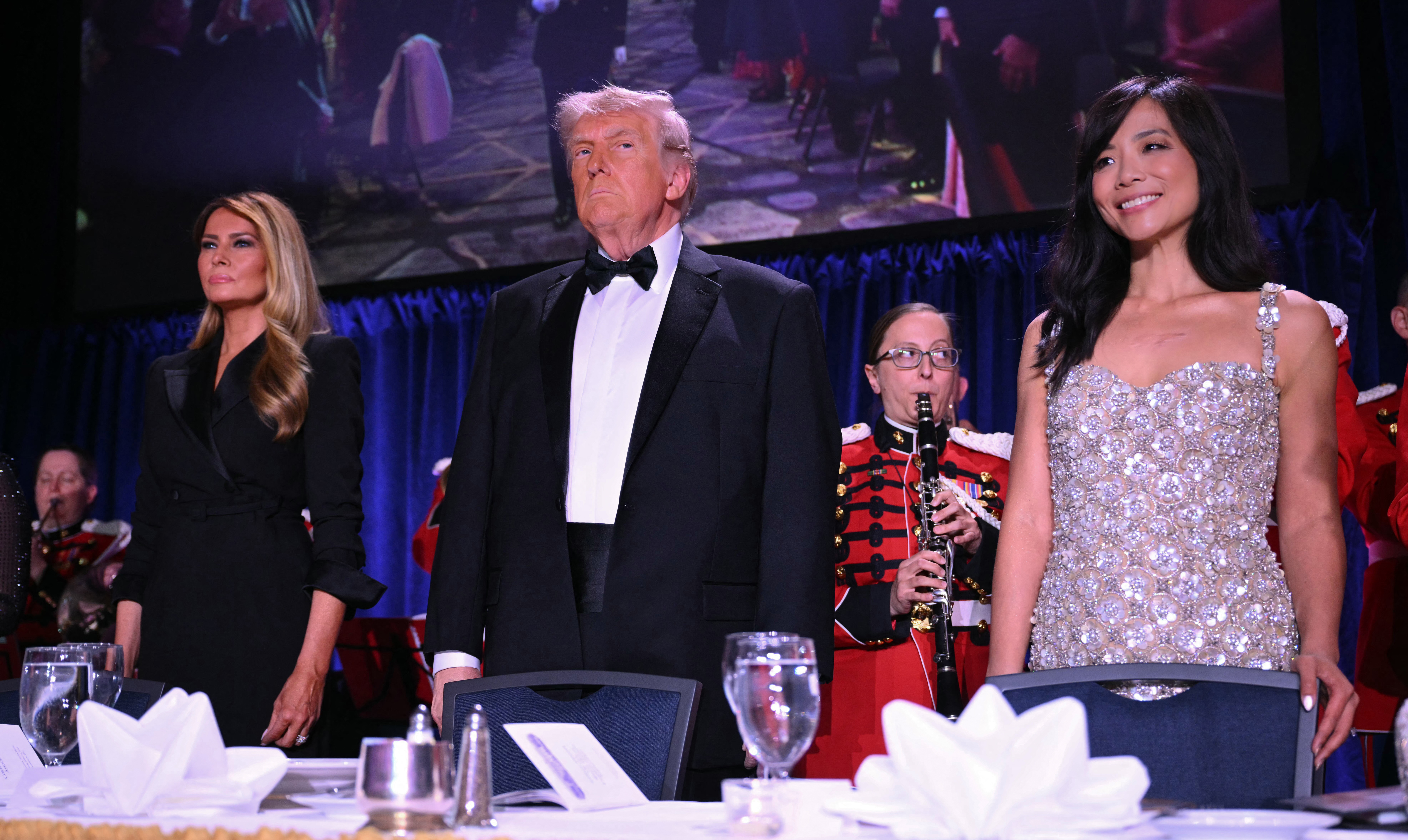 (FILES) (L/R) US First Lady Melania Trump, US President Donald Trump and CBS News senior White House correspondent Weijia Jiang attend the White House Correspondents' dinner at the Washington Hilton in Washington, DC, on April 25, 2026.