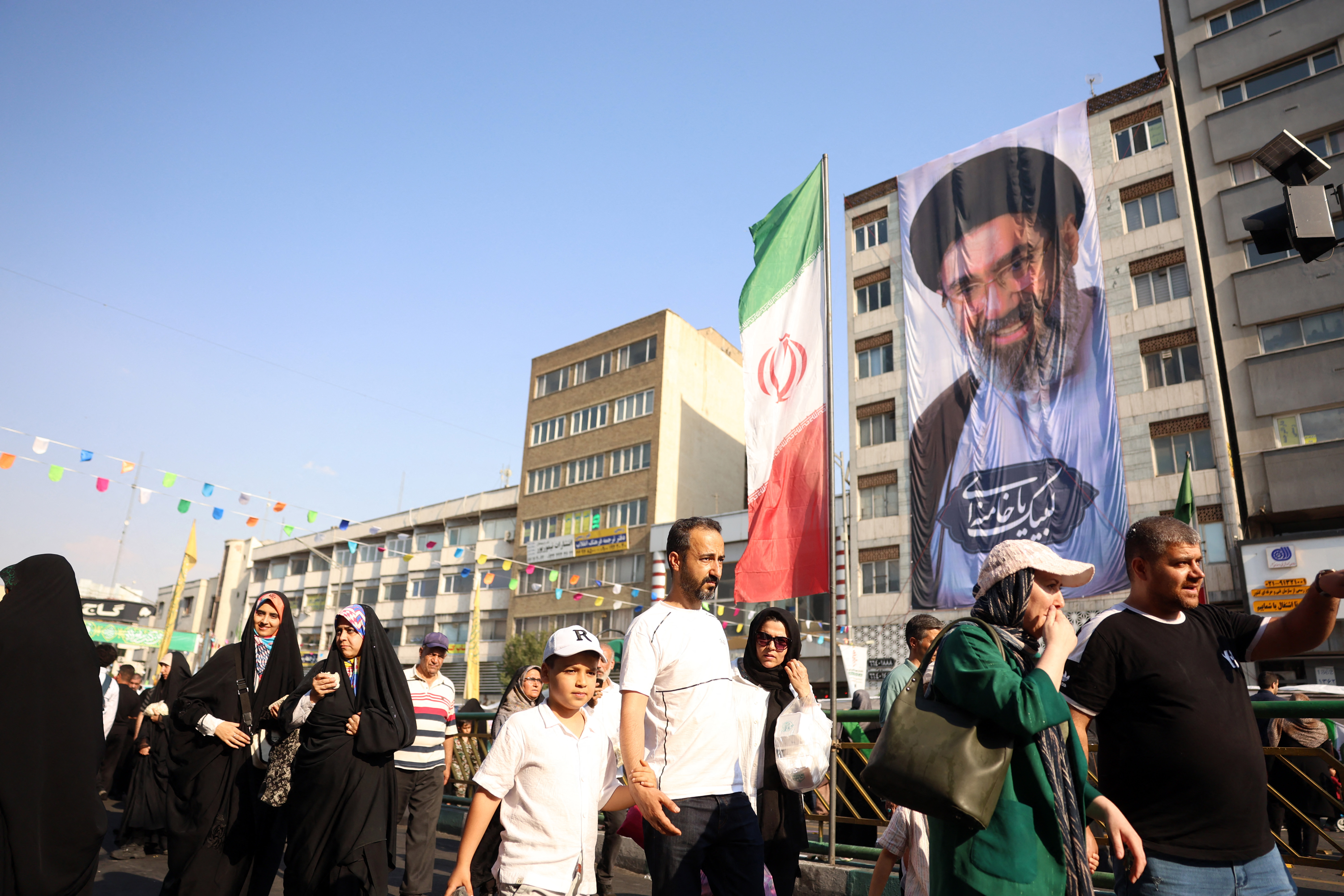 Iranians take part during a rally in support of the country's supreme leader Mojtaba Khamenei and commemorate Eid al-Ghadir in Tehran on June 4, 2026.