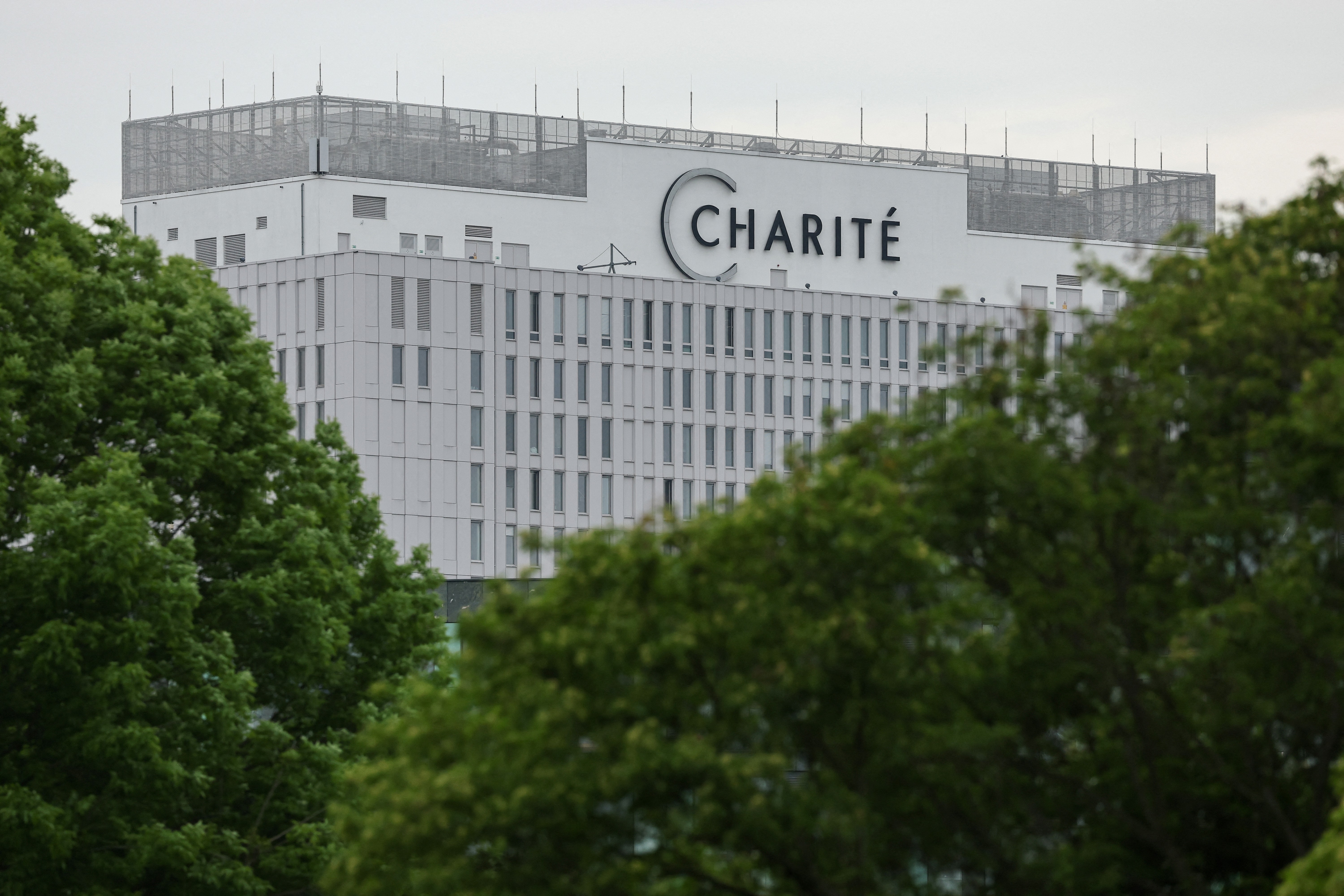 (FILES) The main building of the Charite hospital is pictured is seen behind trees in Berlin on May 11, 2026.