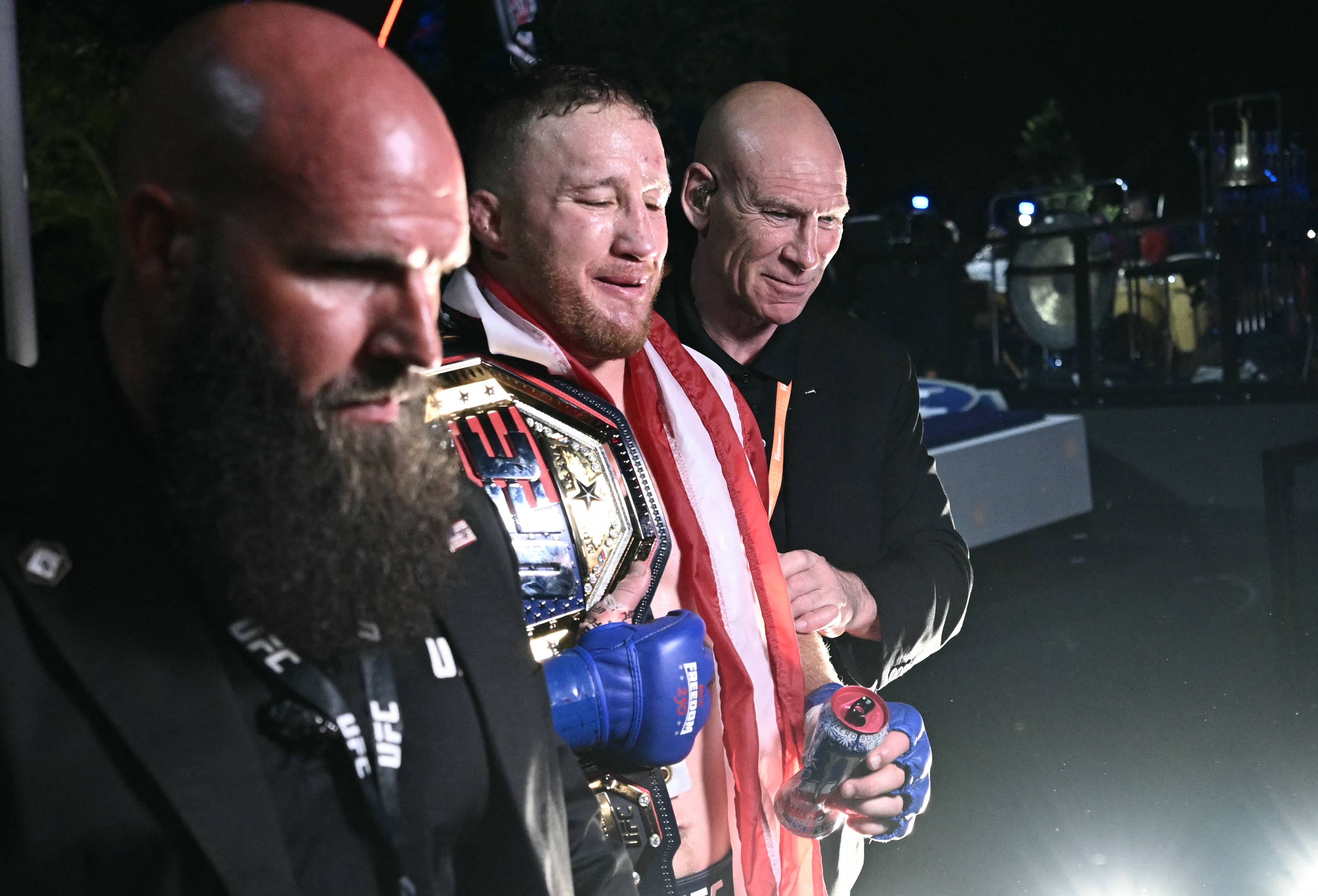 Mixed martial artist US's Justin Gaethje (C) leaves after defeating Georgia’s Ilia Topuria in their lightweight title bout during the "UFC Freedom 250" mixed martial arts event on the South Lawn of the White House in Washington, DC, early morning on June 15, 2026.