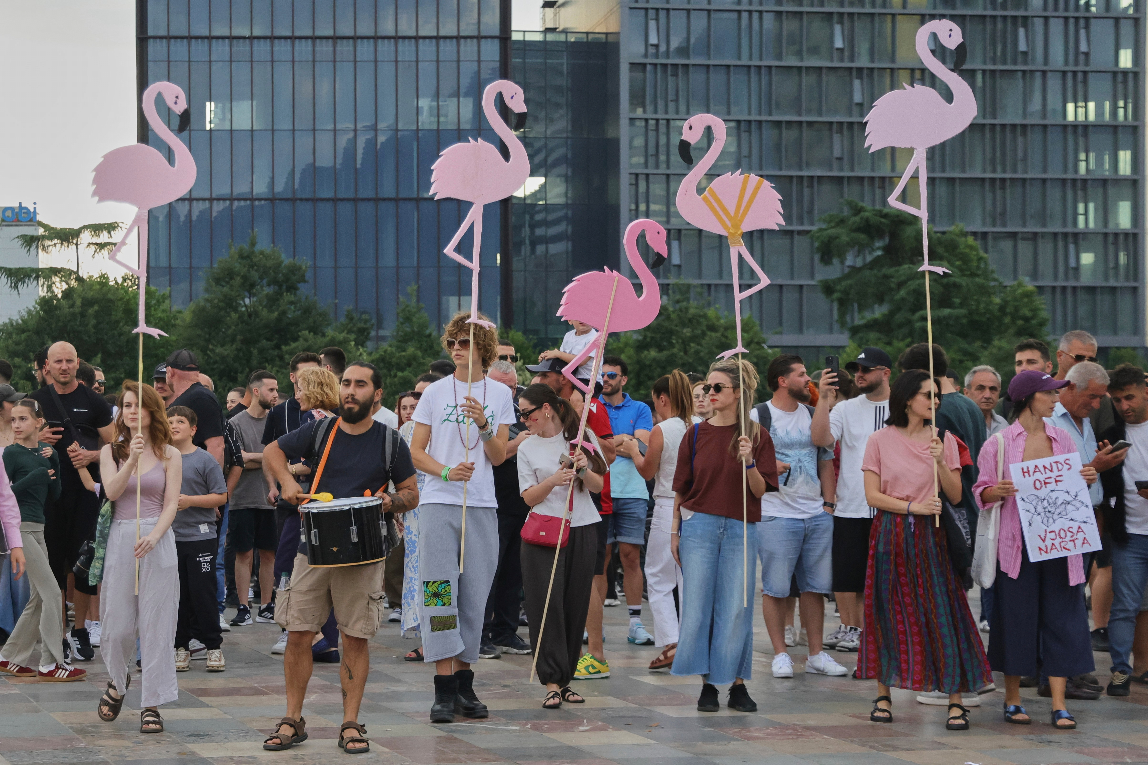 Protesters hold pink flamingo cutouts during a demonstration in Tirana, Albania, Wednesday, June 3, 2026, opposing a luxury coastal development project linked to Jared Kushner and Ivanka Trump over concerns about environmental impacts and transparency. (AP Photo/Hameraldi Agolli)