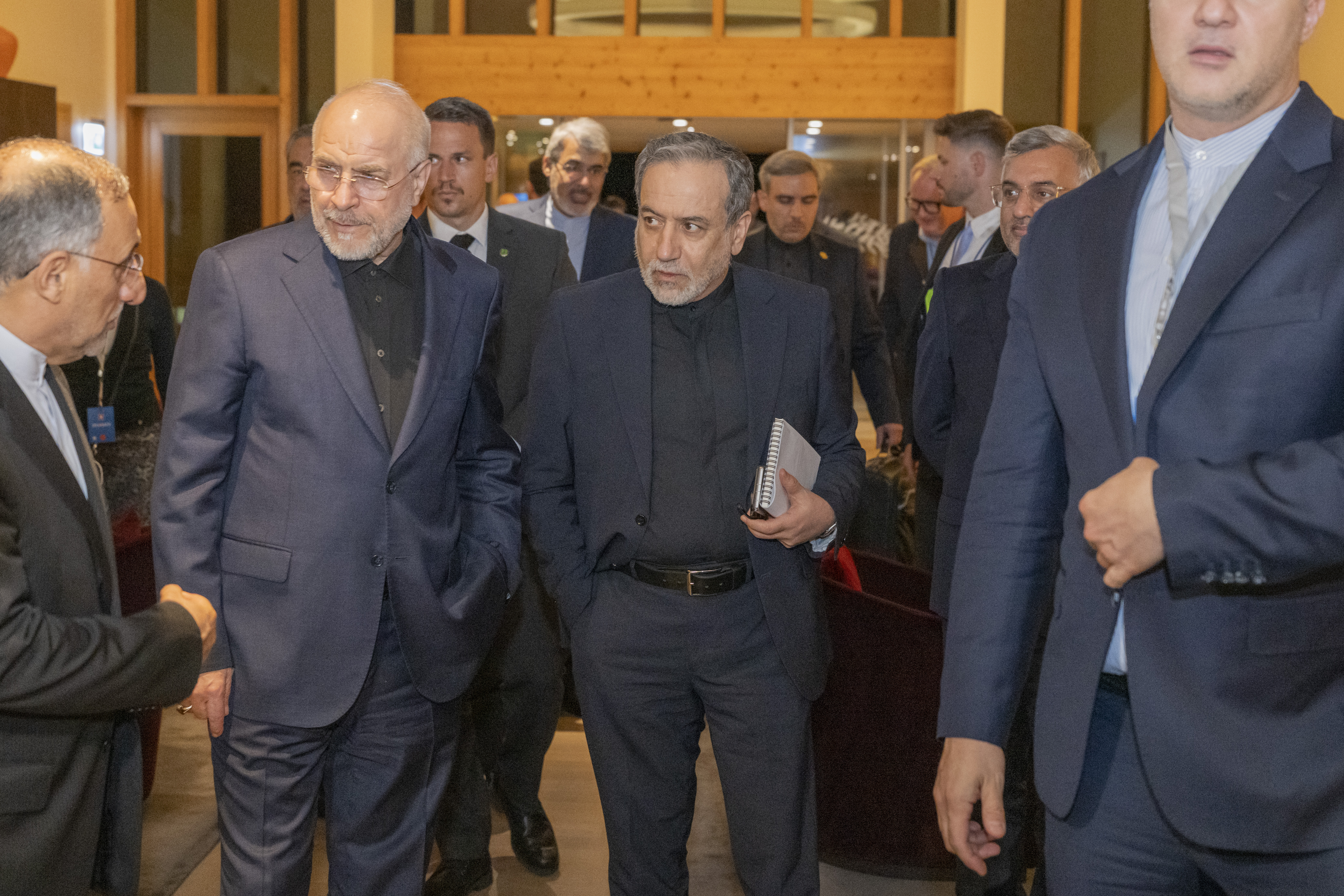 epa13052908 Iran's Speaker of the Islamic Parliament, Mohammed Bagher Ghalibaf (L), and the Minister of Foreign Affairs of Iran, Seyyed Abbas Araghchi (C), attend a meeting at the Bürgenstock resort in Obbürgen, near Lucerne, Switzerland, Sunday, 21 June 2026. Following the signing of a framework agreement on peace in France this week, delegations from the USA and Iran meet at the Bürgenstock resort to discuss further details and technical issues. EPA/URS FLUEELER