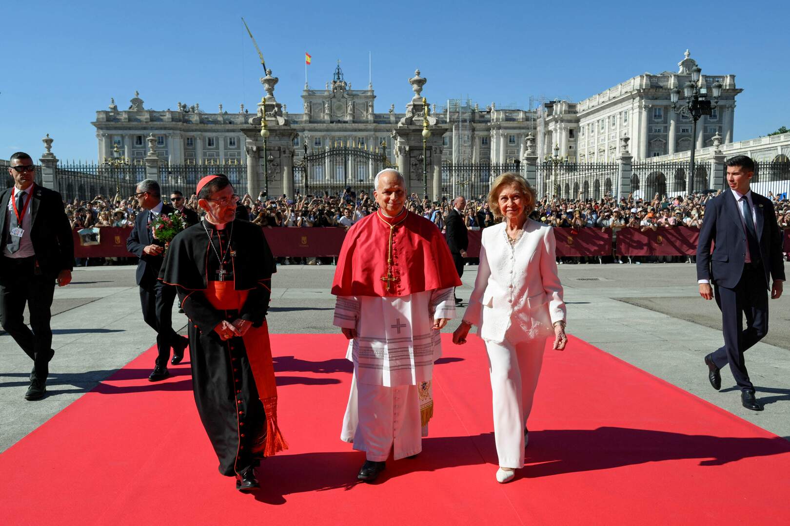 Pope Leo XIV, Spain's former Queen Sofia and Archbishop of Madrid Cardinal Jose Cobo Cano, walk as they visit the Almudena Cathedral in Madrid, Spain, June 8, 2026. Simone Risoluti/Vatican Media/&shy;Handout