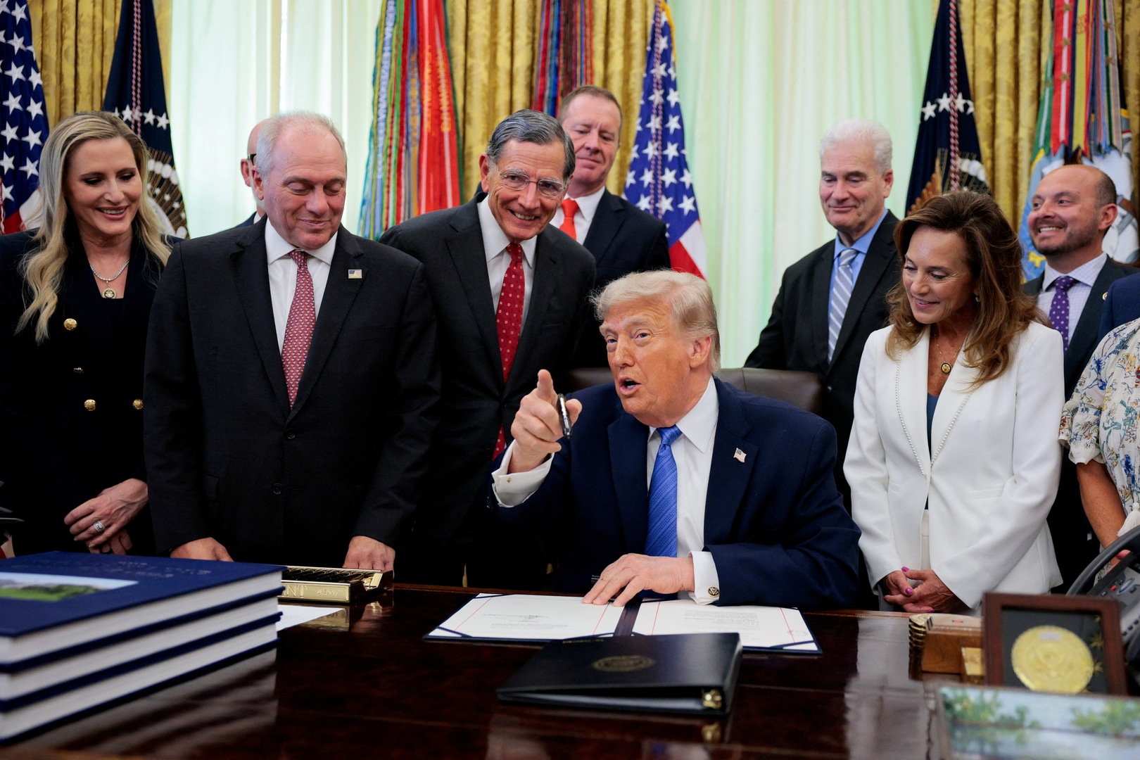 U.S. President Donald Trump speaks in the Oval Office as he signs the Secure America Act, at the White House in Washington, D.C., U.S., June 10, 2026. [Evan Vucci/Reuters]