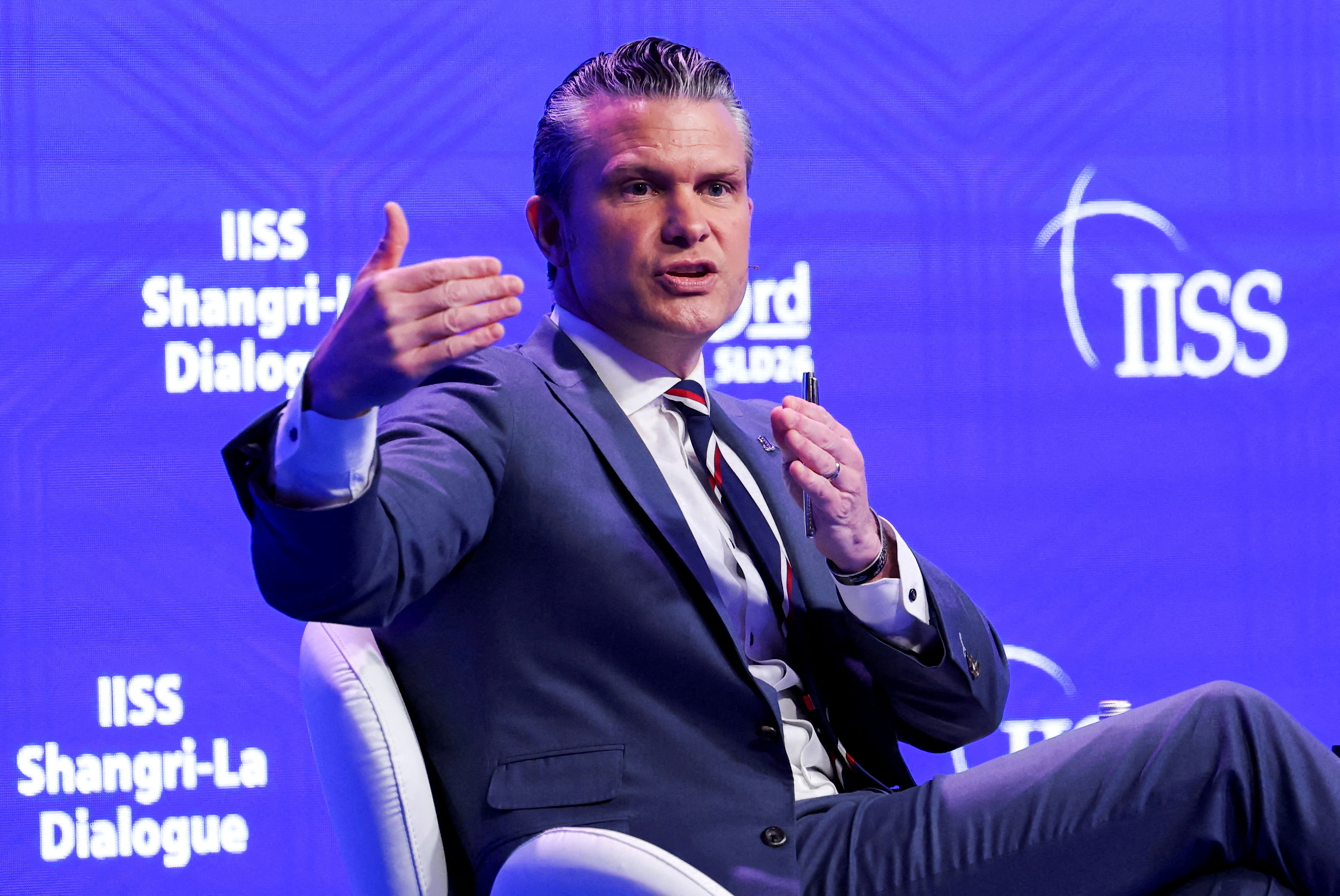 FILE PHOTO: U.S. Secretary of Defense Pete Hegseth speaks at the IISS Shangri-La Dialogue security summit in Singapore, May 30, 2026. REUTERS/Edgar Su/File Photo
