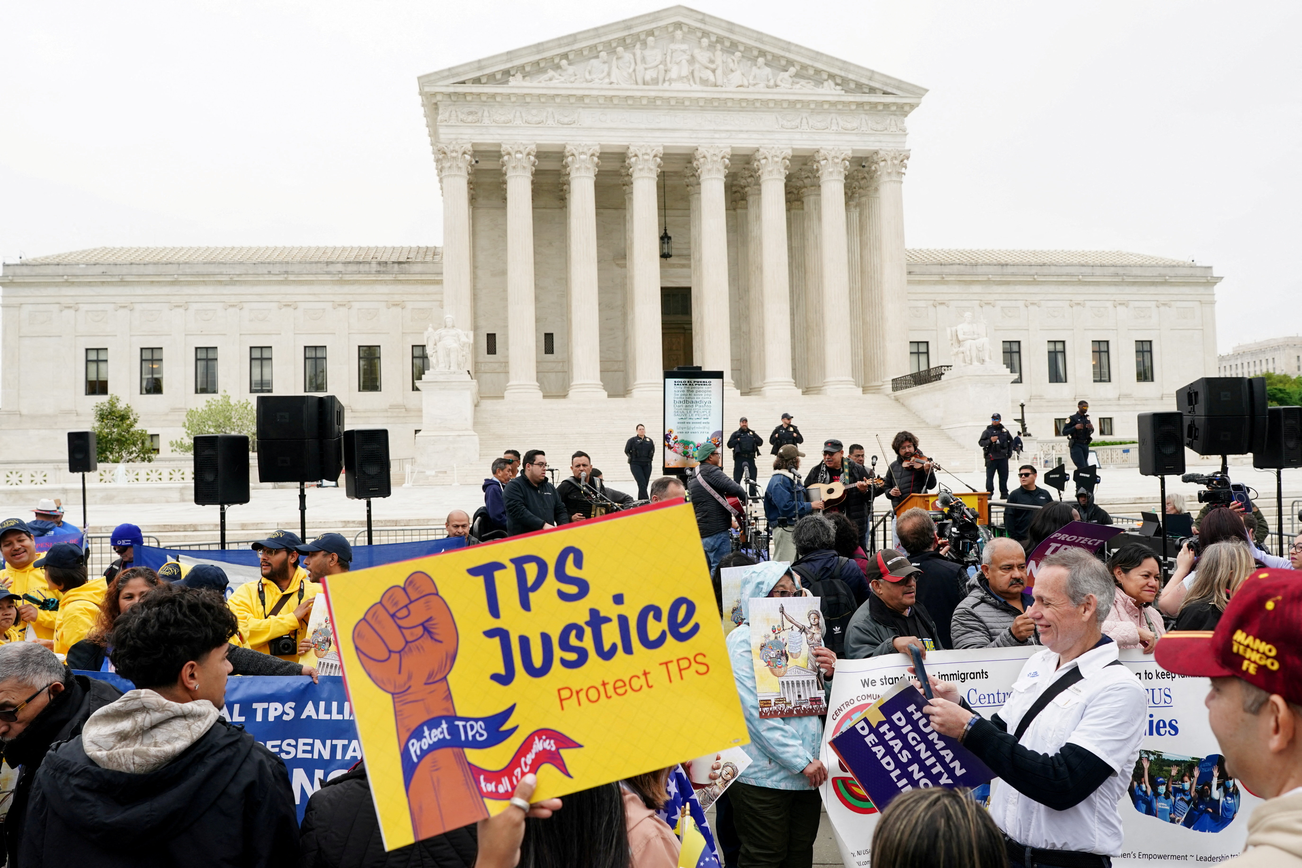 FILE PHOTO: Immigrants' rights activists and demonstrators attend a rally outside the U.S. Supreme Court, as justices were scheduled to hear arguments on whether the administration of U.S. President Donald Trump can end the Temporary Protected Status (TPS) of Syrian and Haitian nationals, in Washington, D.C., U.S., April 29, 2026. REUTERS/Nathan Howard/File Photo