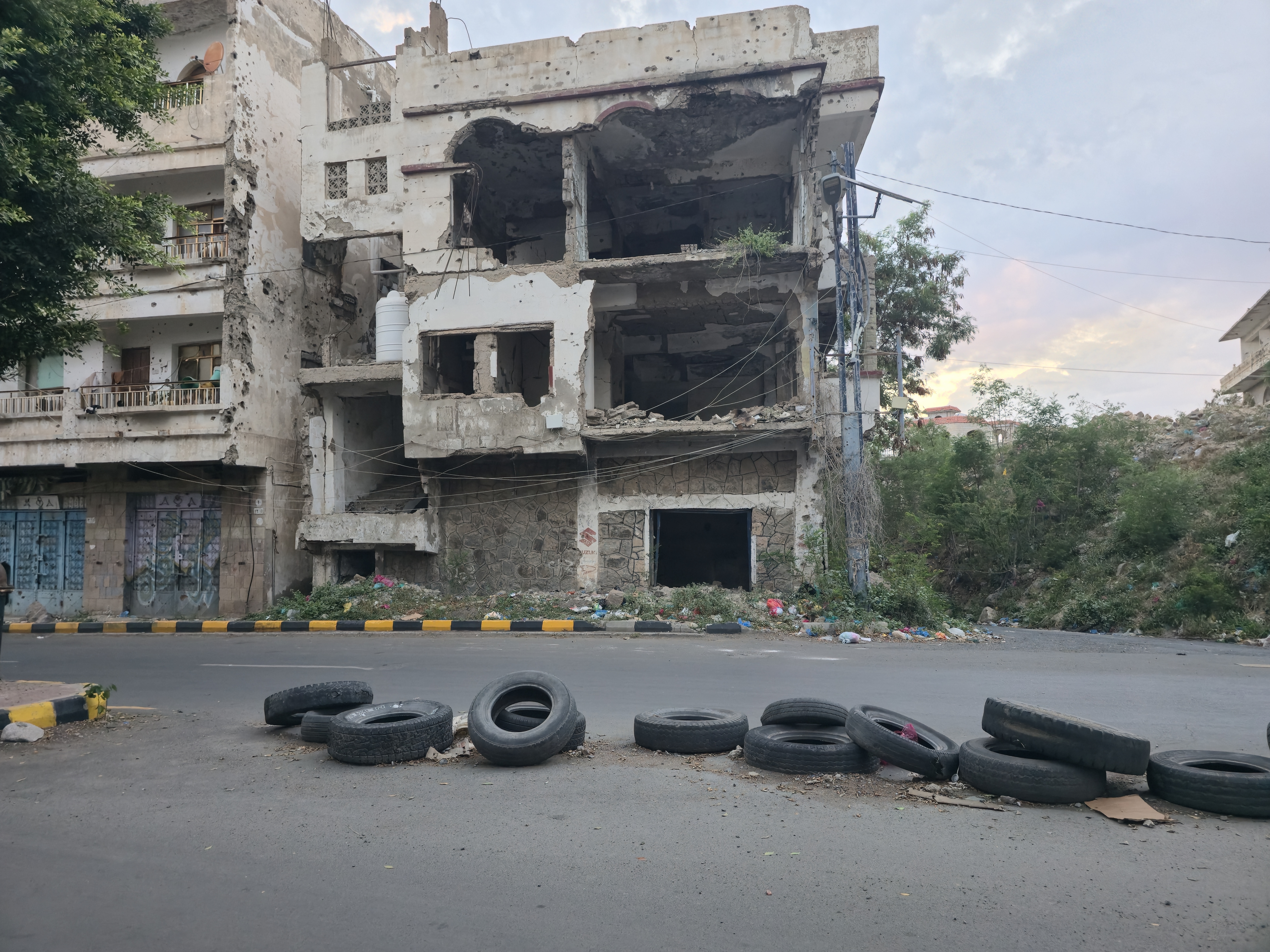 A damaged home on a street