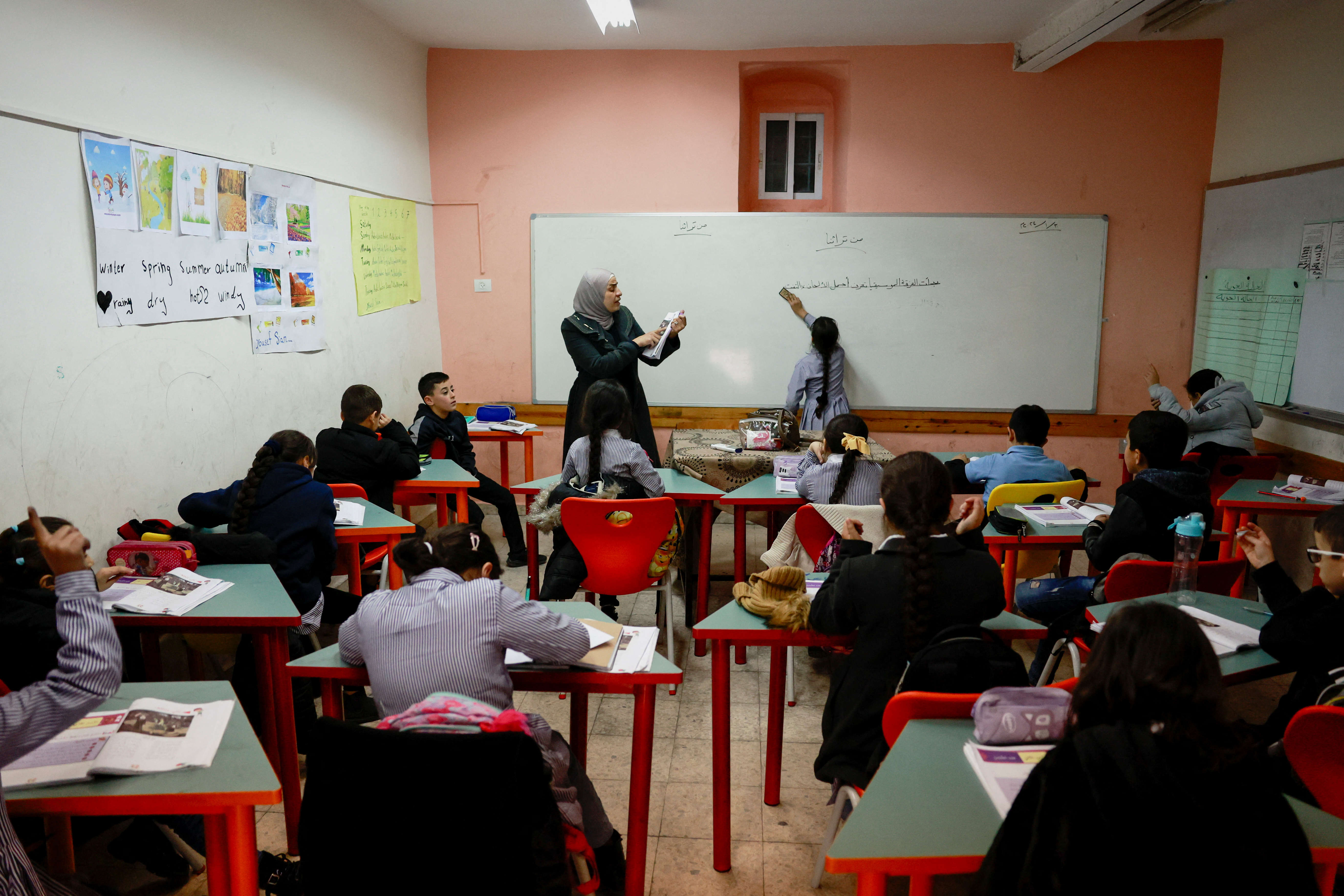 Palestinian girls learn Arabic at the UNRWA Jerusalem Girls' School in the Silwan neighbourhood of East Jerusalem, January 30, 2024. REUTERS/Ammar Awad
