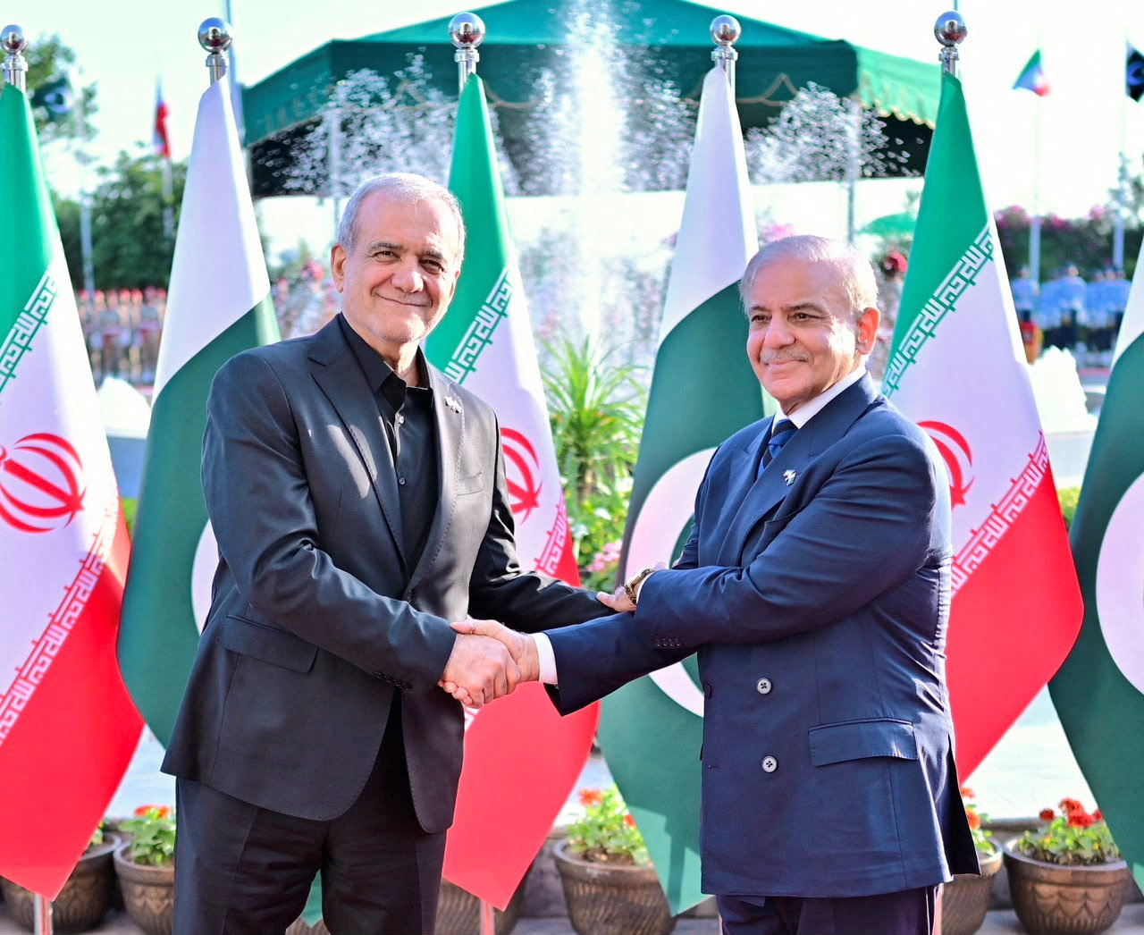 Pakistan's Prime Minister Shehbaz Sharif receives the President of Iran, Masoud Pezeshkian, upon his arrival at the Prime Minister's House in Islamabad, Pakistan, June 23, 2026. External Publicity Wing (EPW)/Handout via REUTERS ATTENTION EDITORS - THIS PICTURE WAS PROVIDED BY A THIRD PARTY. NO RESALES. NO ARCHIVES.