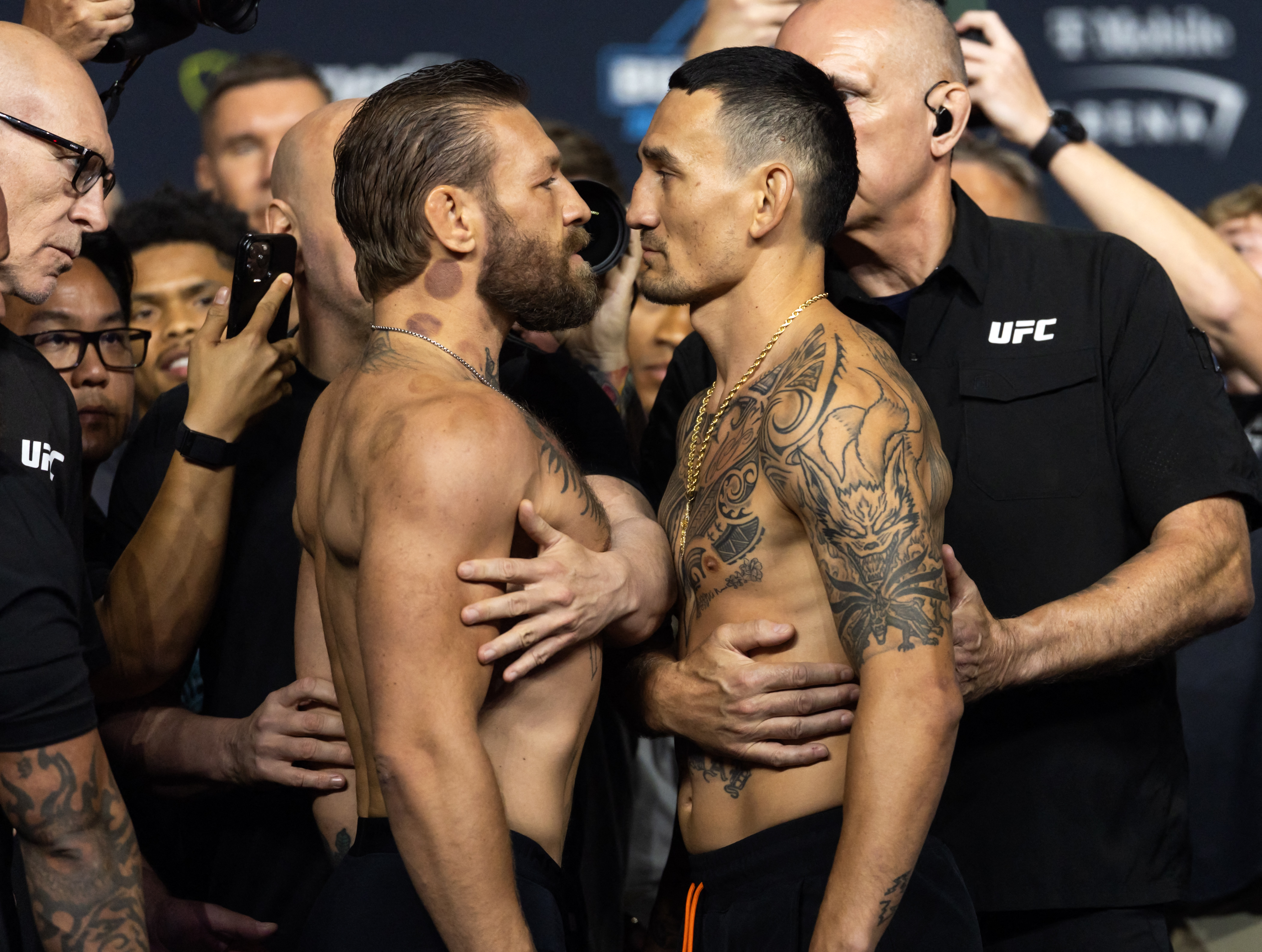 Jul 10, 2026; Las Vegas, Nevada, USA; Conor McGregor (left) faces off with Max Holloway during weigh ins for UFC 329 at T-Mobile Arena. Mandatory Credit: Mark J. Rebilas-Imagn Images