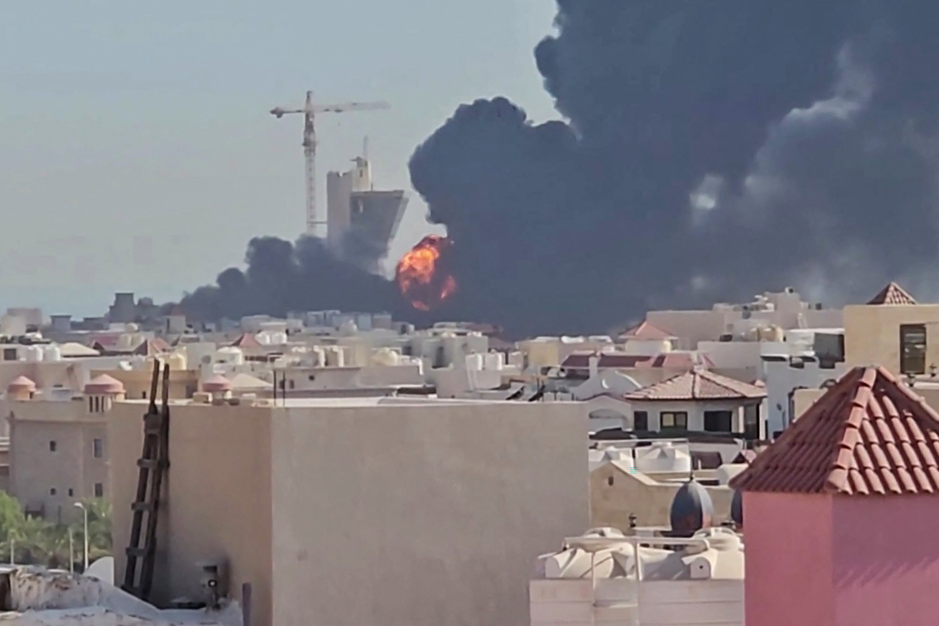 Flames and black smoke rise over the town of Mangaf, south of Kuwait City, after Kuwait accused Iran on July 18, 2026, of targeting civilian sites and vital infrastructure in the Gulf country [AFP]