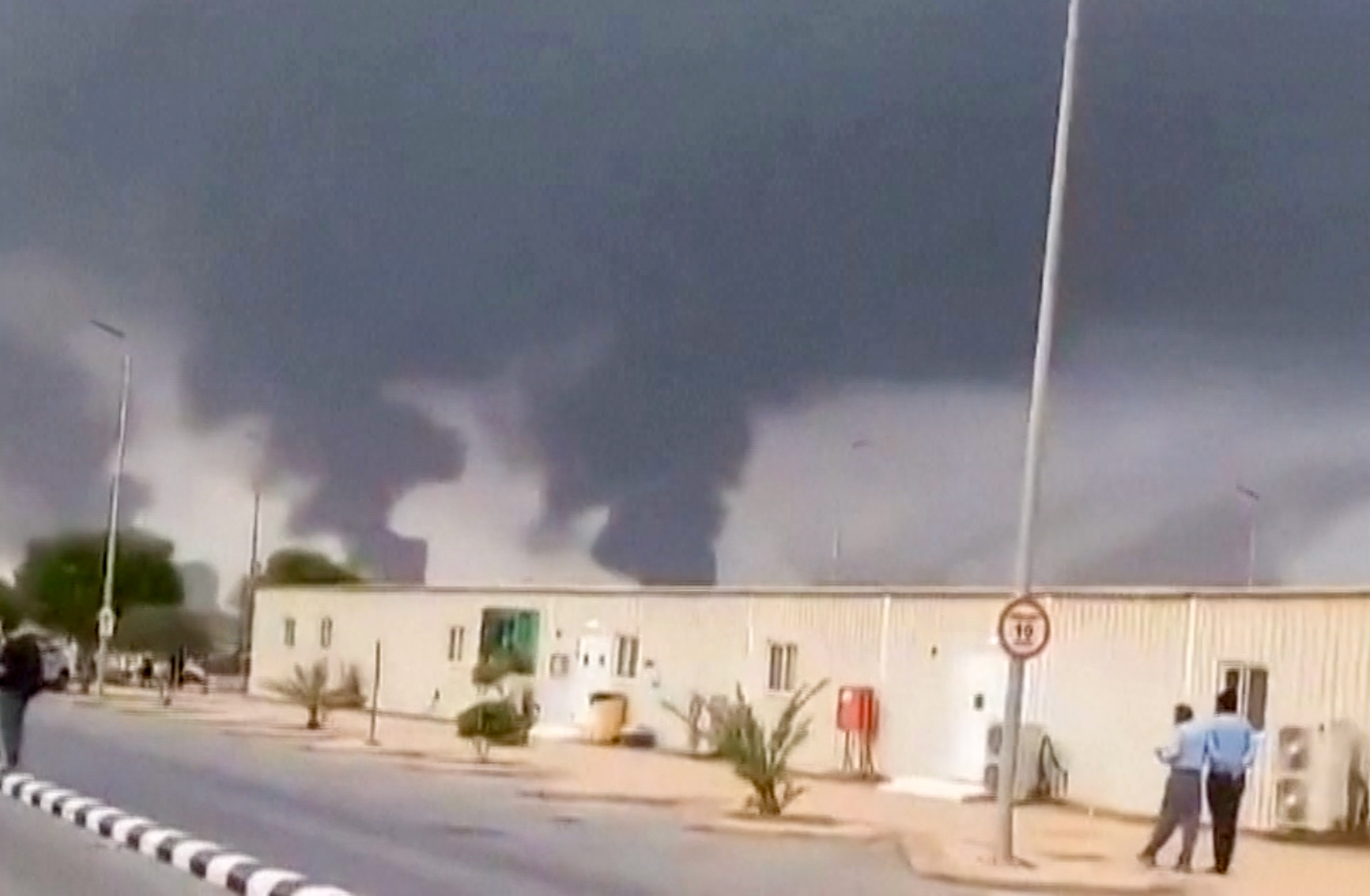 This screen grab taken on July 25, 2026 from an undated UGC video footage posted on social media and verified by AFPTV teams shows clouds of smoke rising after strikes on the Saudi Aramco refinery in Jizan.