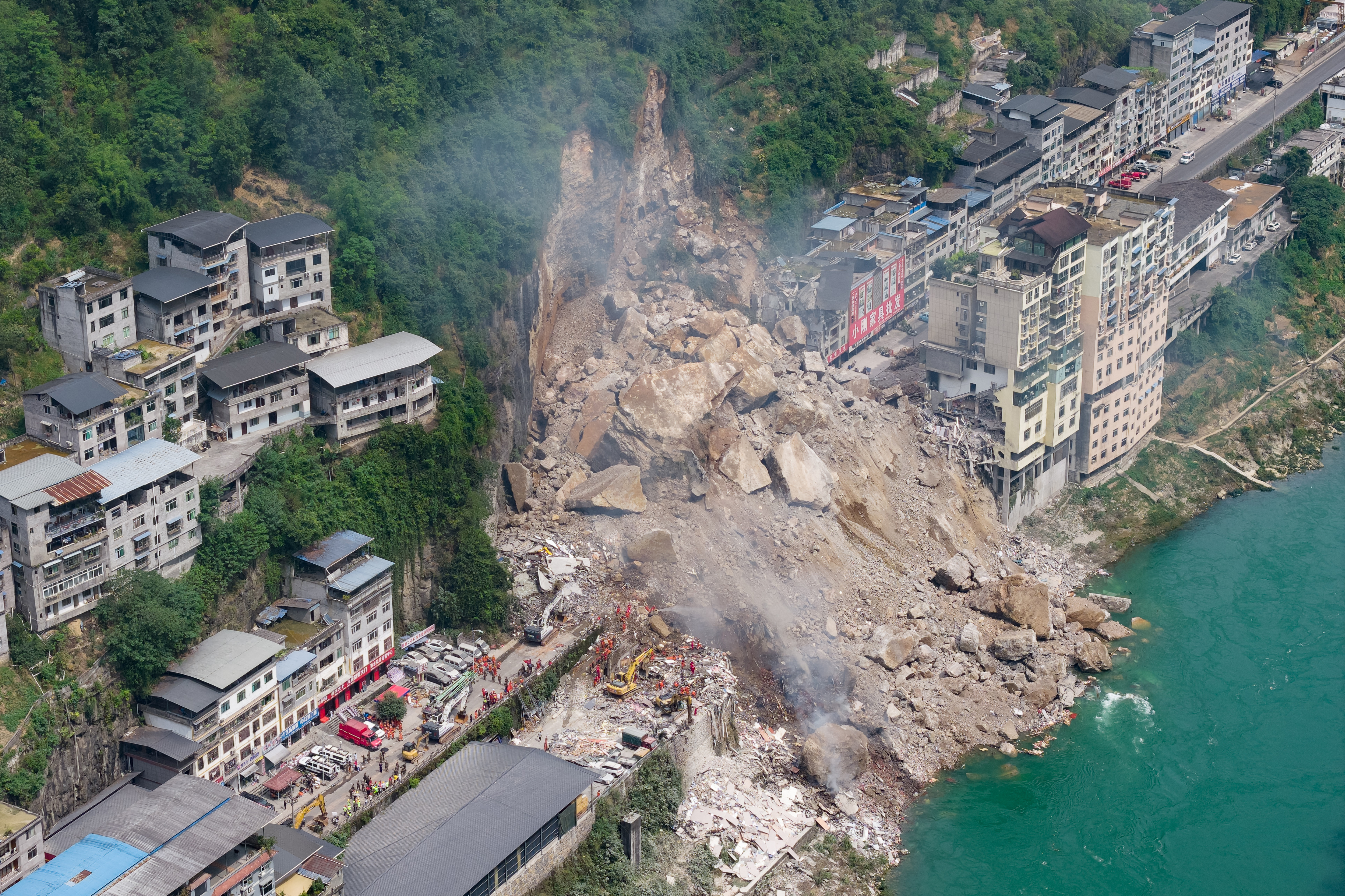 Rescue workers search for survivors at the site of a landslide in Pengshui County in Chongqing, China on July 17, 2026.