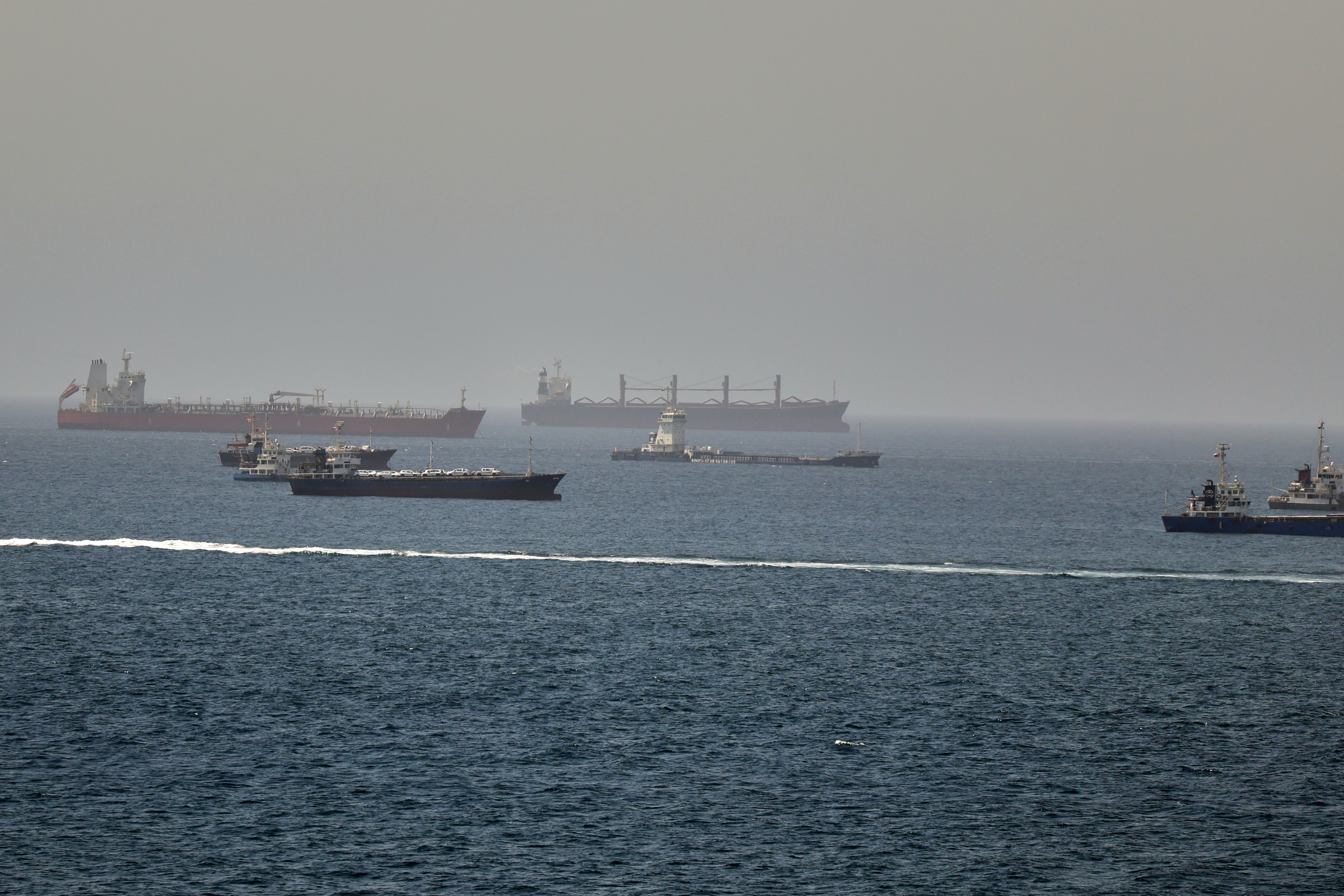 Tankers and cargo vessels are seen in the Gulf of Oman, along shipping routes linking the Strait of Hormuz and the Arabian Sea, Tuesday, June 16, 2026. (AP Photo)