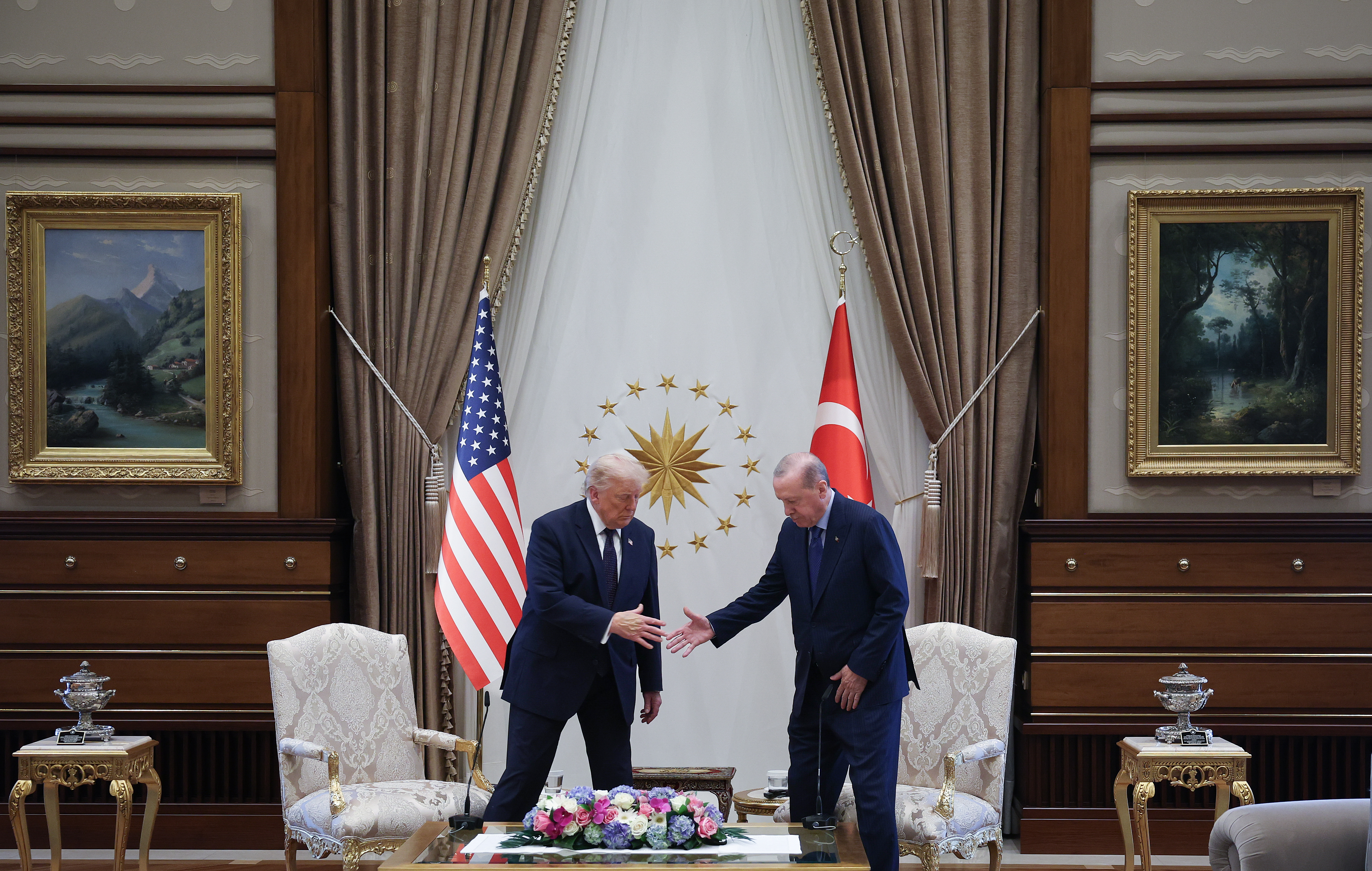 ANKARA, TURKEY - JULY 07: U.S. President Donald Trump (L) reaches to shake hands with Turkish President Recep Tayyip Erdoğan ahead of a bilateral meeting at the Bestepe Presidential Compound, following Trump’s arrival to attend the annual NATO Summit on July 7, 2026 in Ankara, Turkey. Leaders from NATO's 32 countries, plus NATO allies like Ukraine, gathered in the Turkish capital to discuss a range of issues involving spending targets, defense industrial production, and support for Ukraine, among other topics. (Photo by Win McNamee/Getty Images)