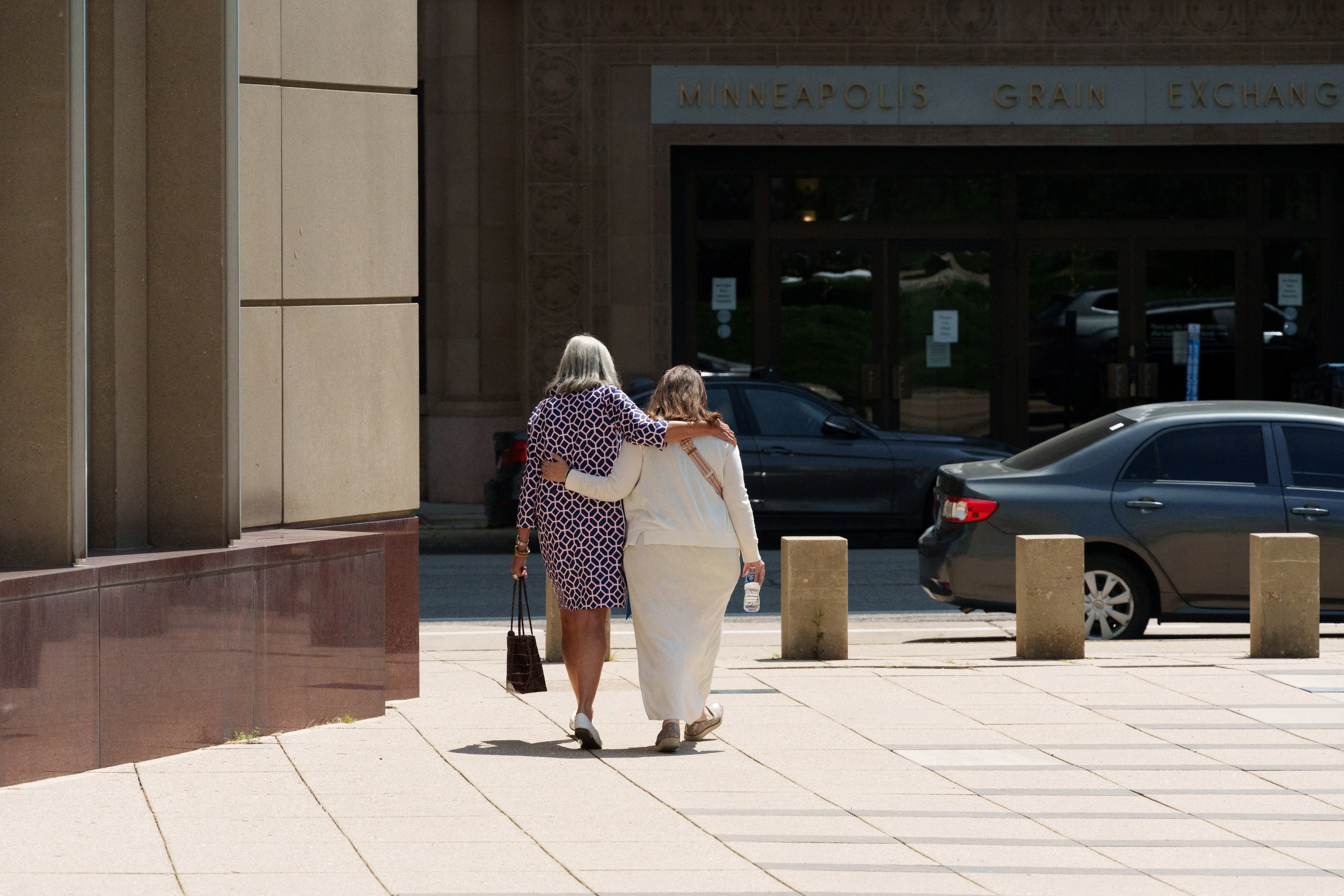 Democratic Minnesota State Representative Ginny Klevorn and Kristin Bahner embrace as they leave the Diana E. Murphy United States Federal Courthouse following the sentencing hearing for Vance Boelter, who pleaded guilty to the 2025 killings of Democratic state Representative Melissa Hortman and her husband Mark, and the shootings of State Senator John Hoffman and his wife Yvette, in Minneapolis, Minnesota, U.S., July 23, 2026. REUTERS/Tim Evans