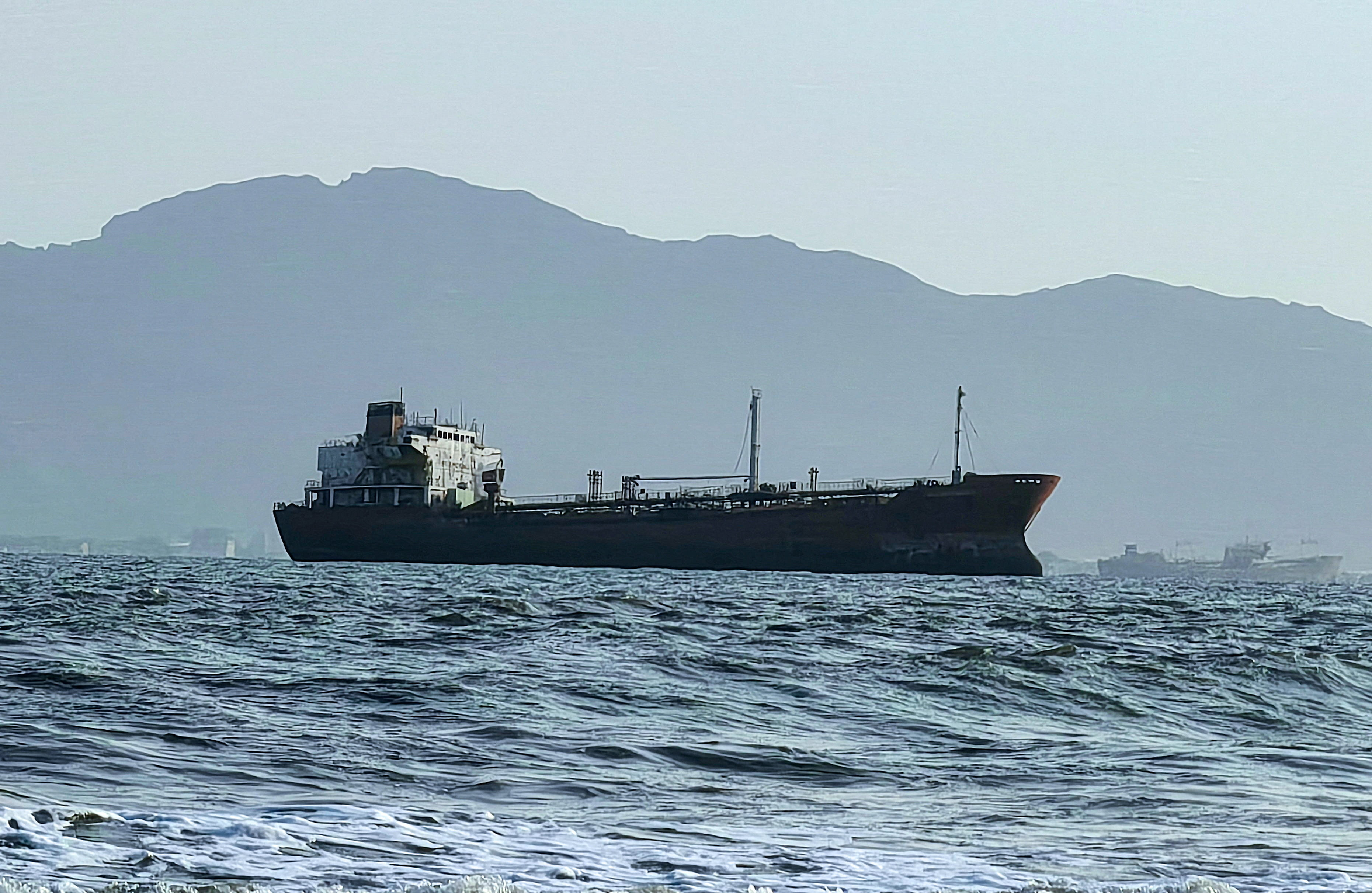A ship off the port of Aden, where traffic remained steady after the Iran-aligned Houthis said their forces had carried out missile and drone strikes on Saudi oil tankers, in Aden, Yemen, July 23, 2026. [File: REUTERS/Stringer]