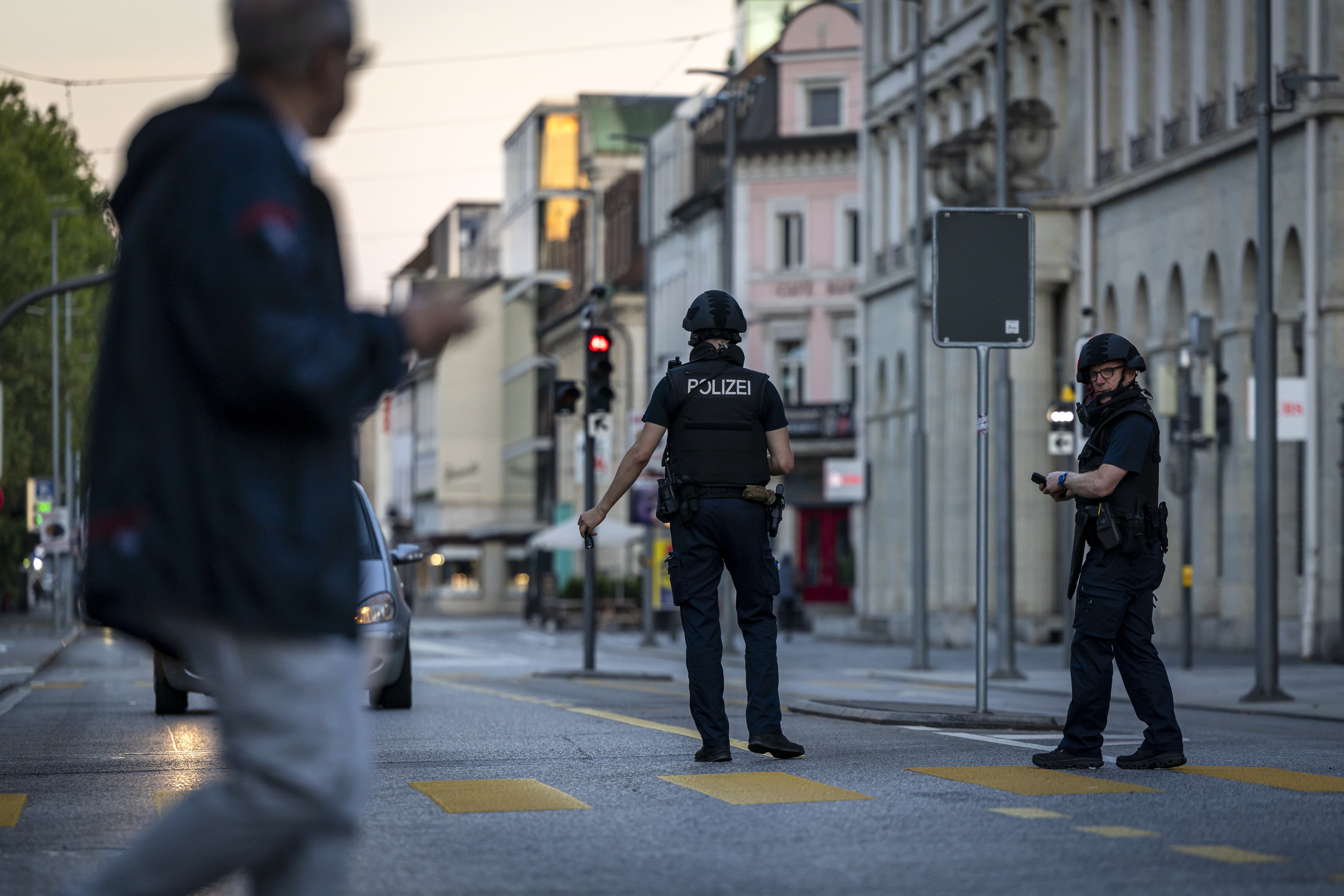Police officers patroll a street in downtown Aarau, Switzerland