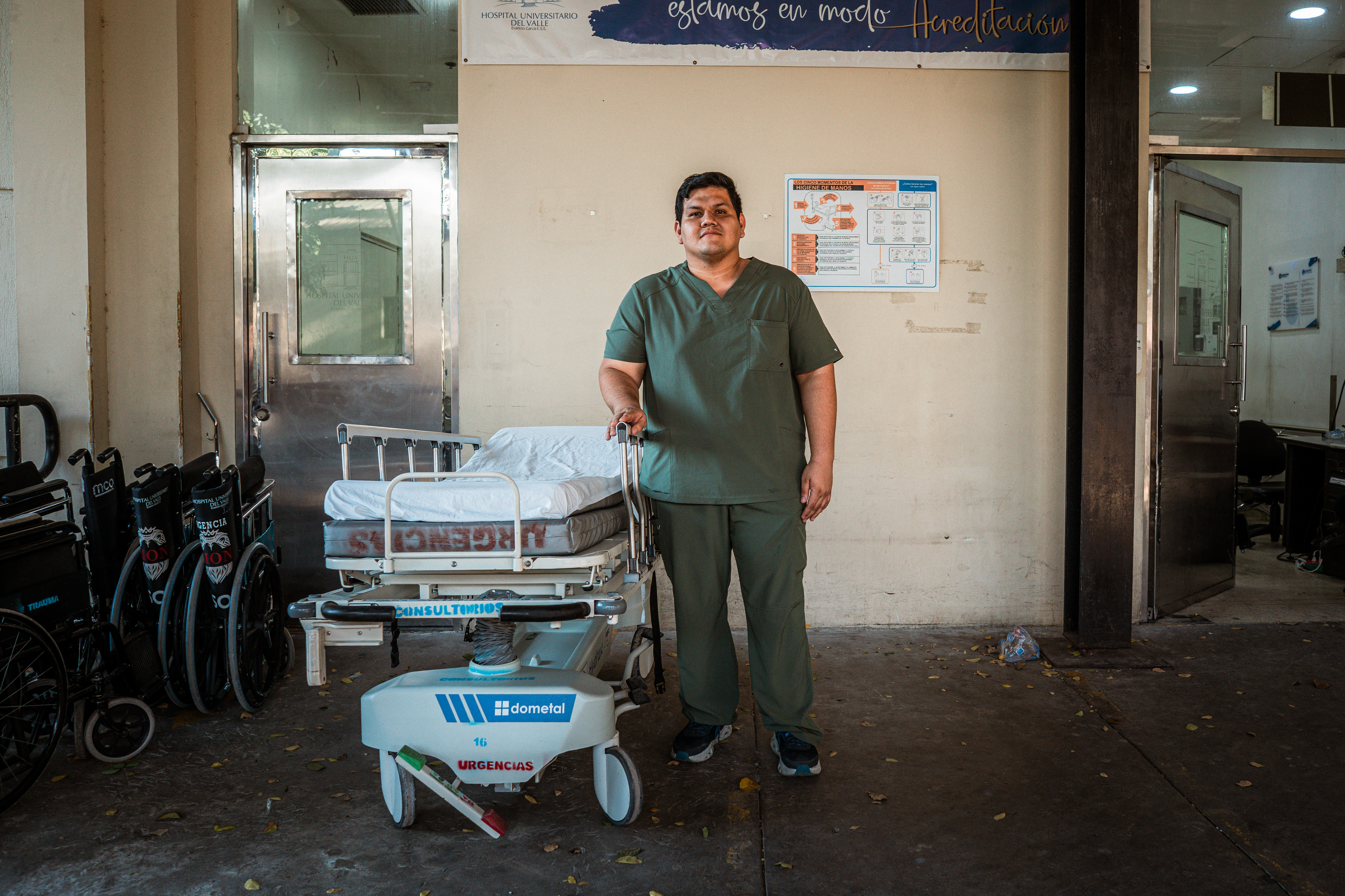 Carlos Naranjo, a General Practitioner at the University Hospital of the Valle Evaristo Garcia, pictured outside the hospital’s emergency department. [Euan Wallace / Al Jazeera]