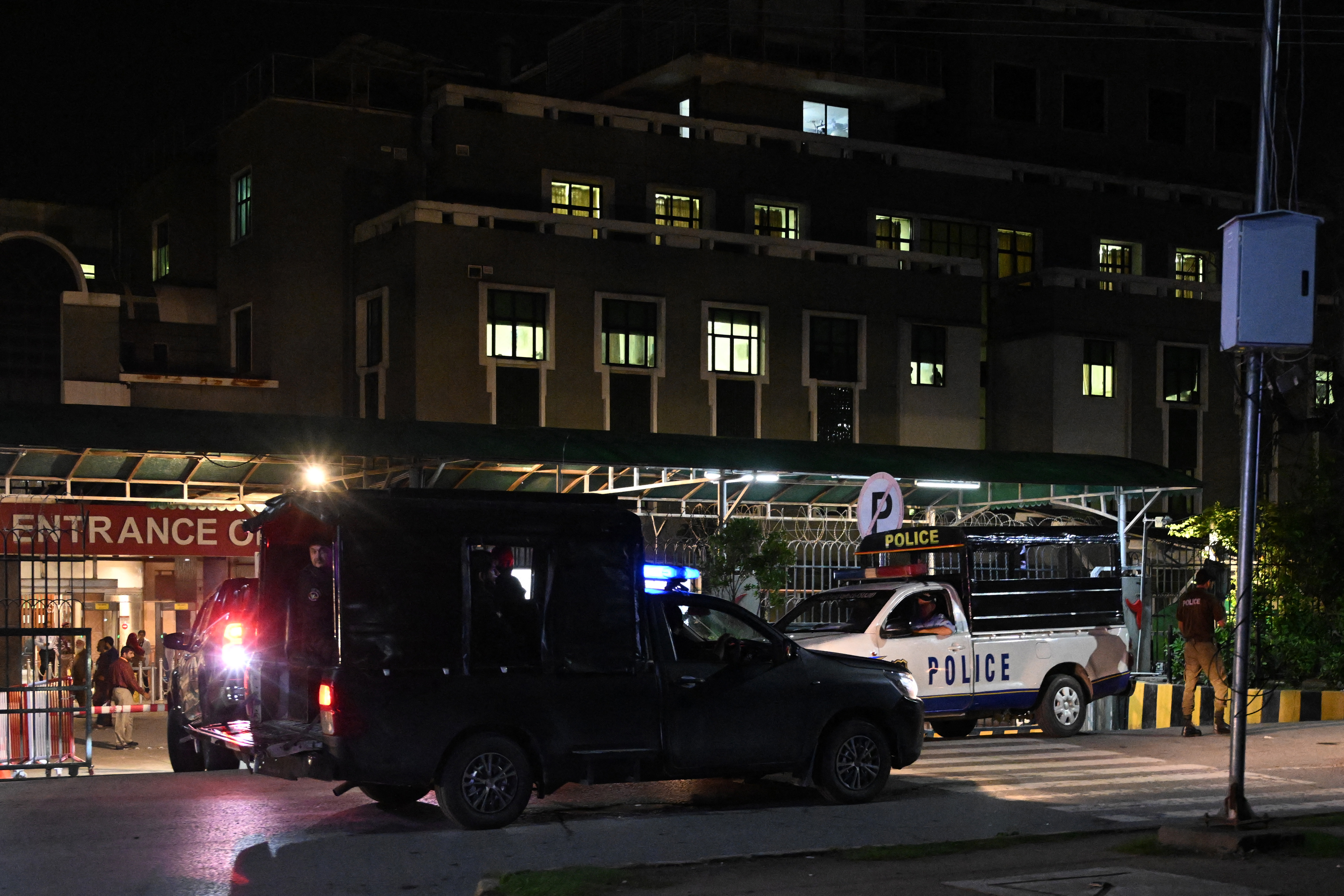Security personnel cordon off a street outside the Shifa International Hospital in Islamabad on August 20, 2026 after Pakistan's Supreme Court ordered to transfer jailed former prime minister Imran Khan to hospital for medical treatment.