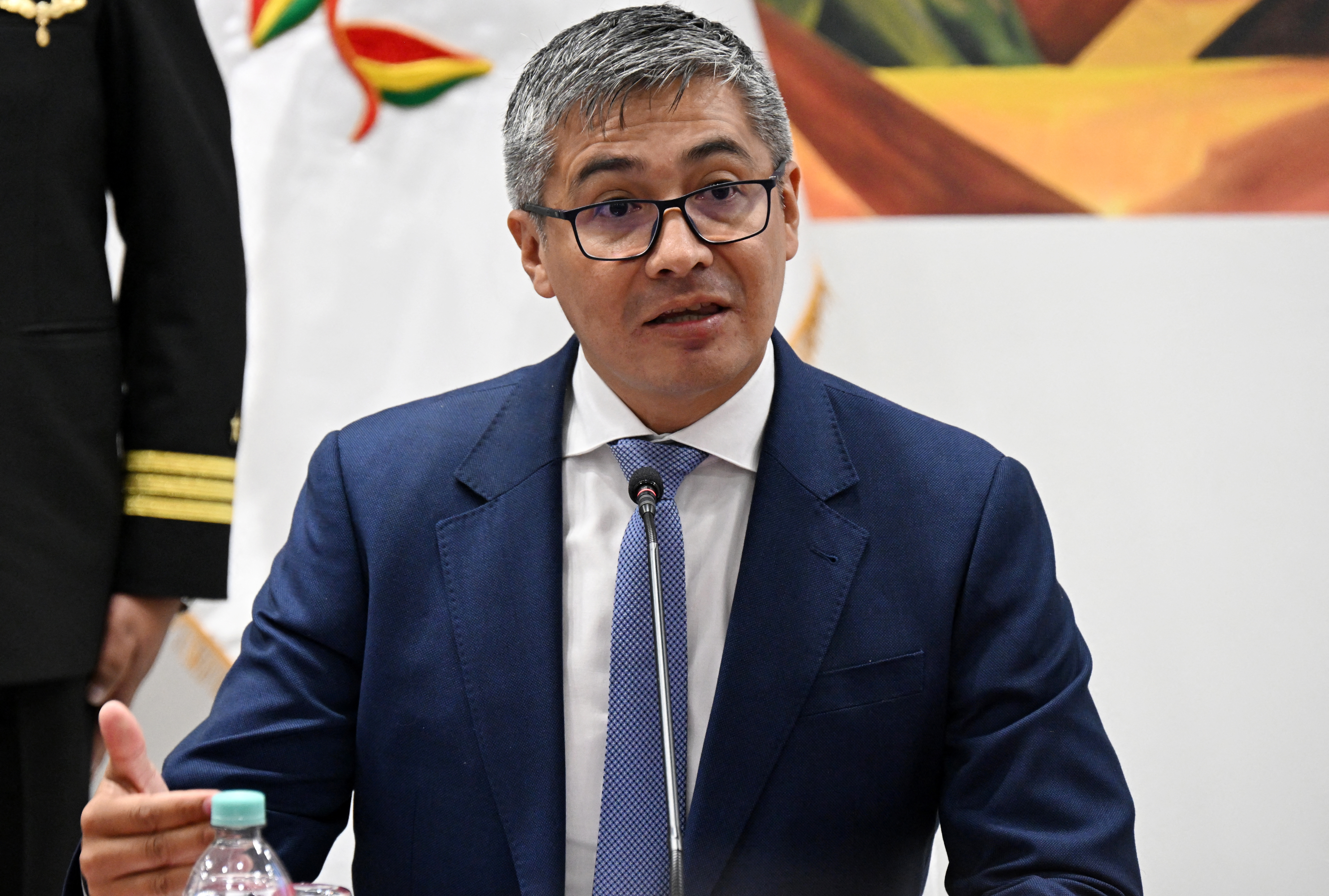 (FILES) Bolivia's Economy Minister Jose Gabriel Espinoza speaks during a press conference after the government revoked decrees on direct contracting and the awarding of public works contracts, at the Casa Grande del Pueblo, the seat of the Government Palace, in La Paz, on April 6, 2026.
