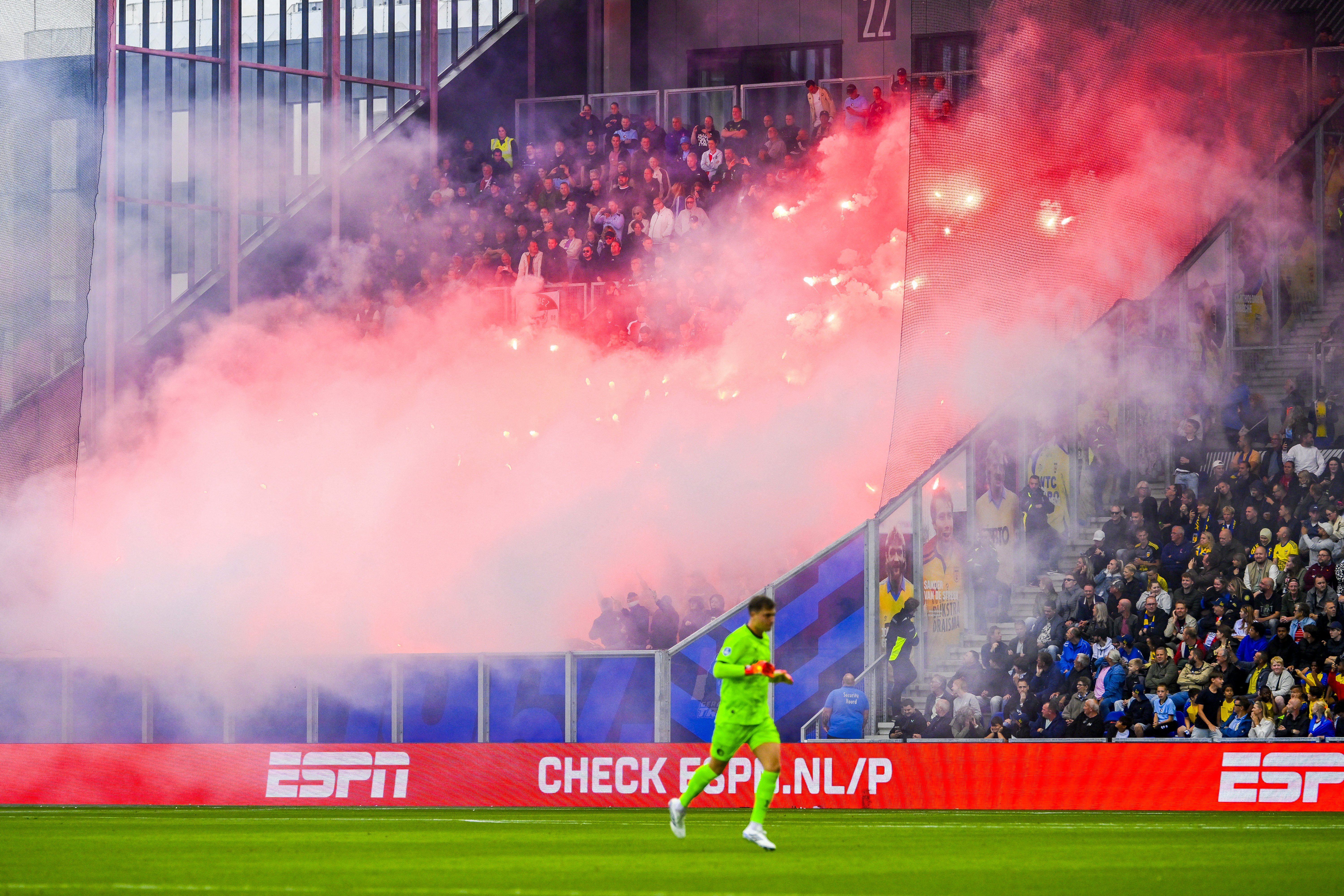 The match is interrupted as Feyenoord supporters light smoke flares during the Dutch Eredivisie football match against Cambuur in Leeuwarden