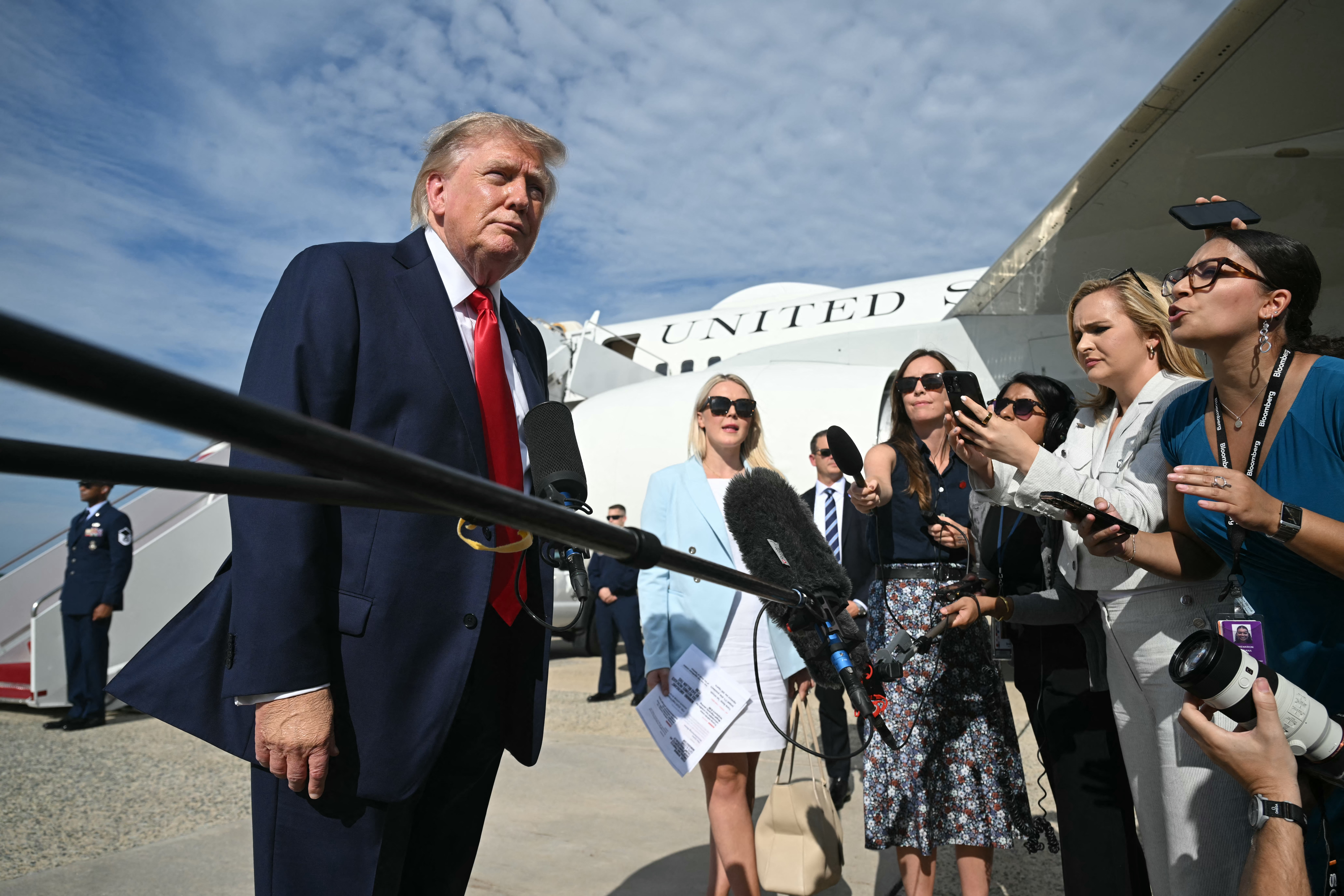US President Donald Trump speaks to reporters before boarding Air Force One at Joint Base Andrews, Maryland on August 21, 2026.