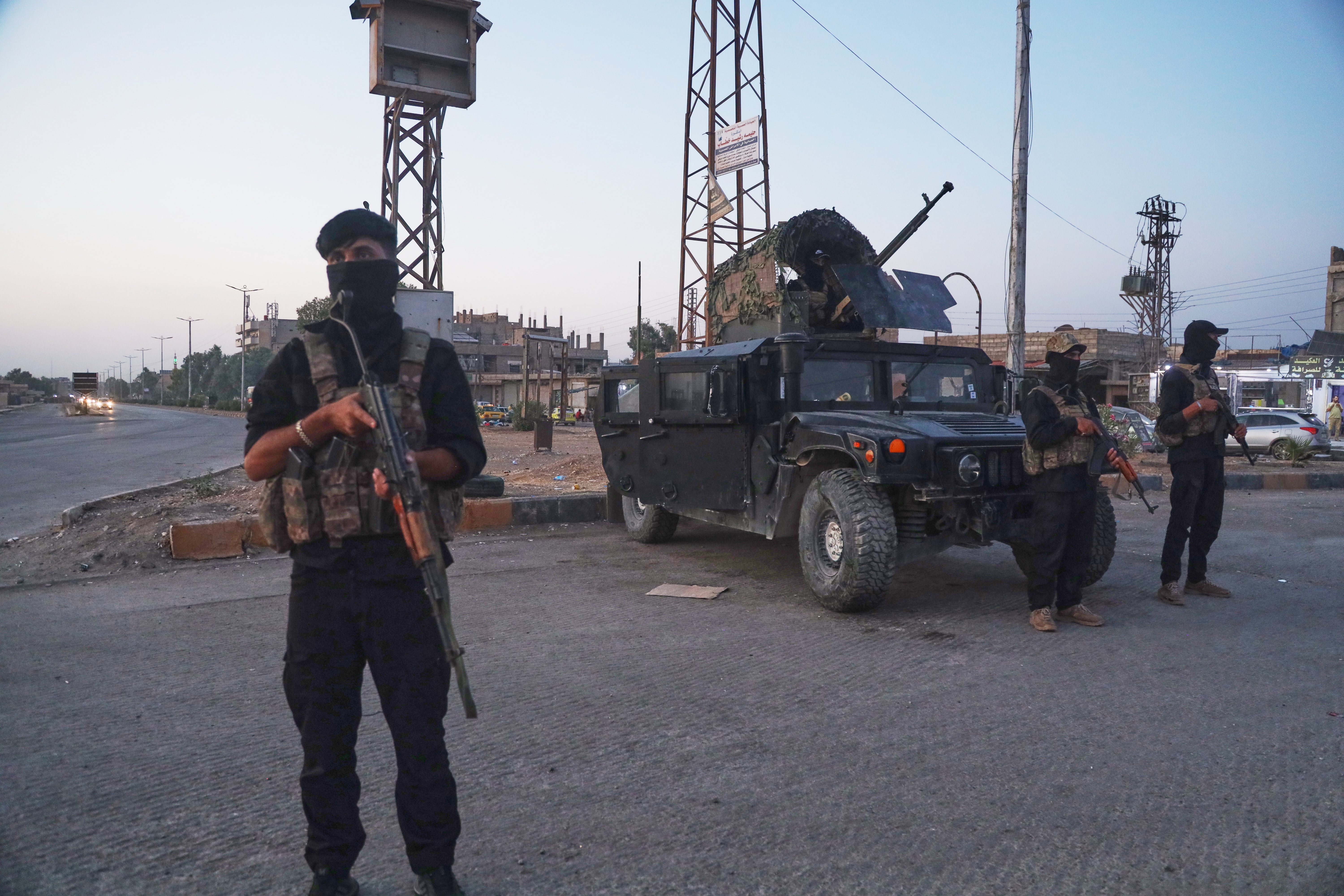 Syrian Democratic Forces (SDF) soldiers stand guard in Hasakah, northeastern Syria, Wednesday, Aug. 26, 2026.(AP Photo/Baderkhan Ahmad)