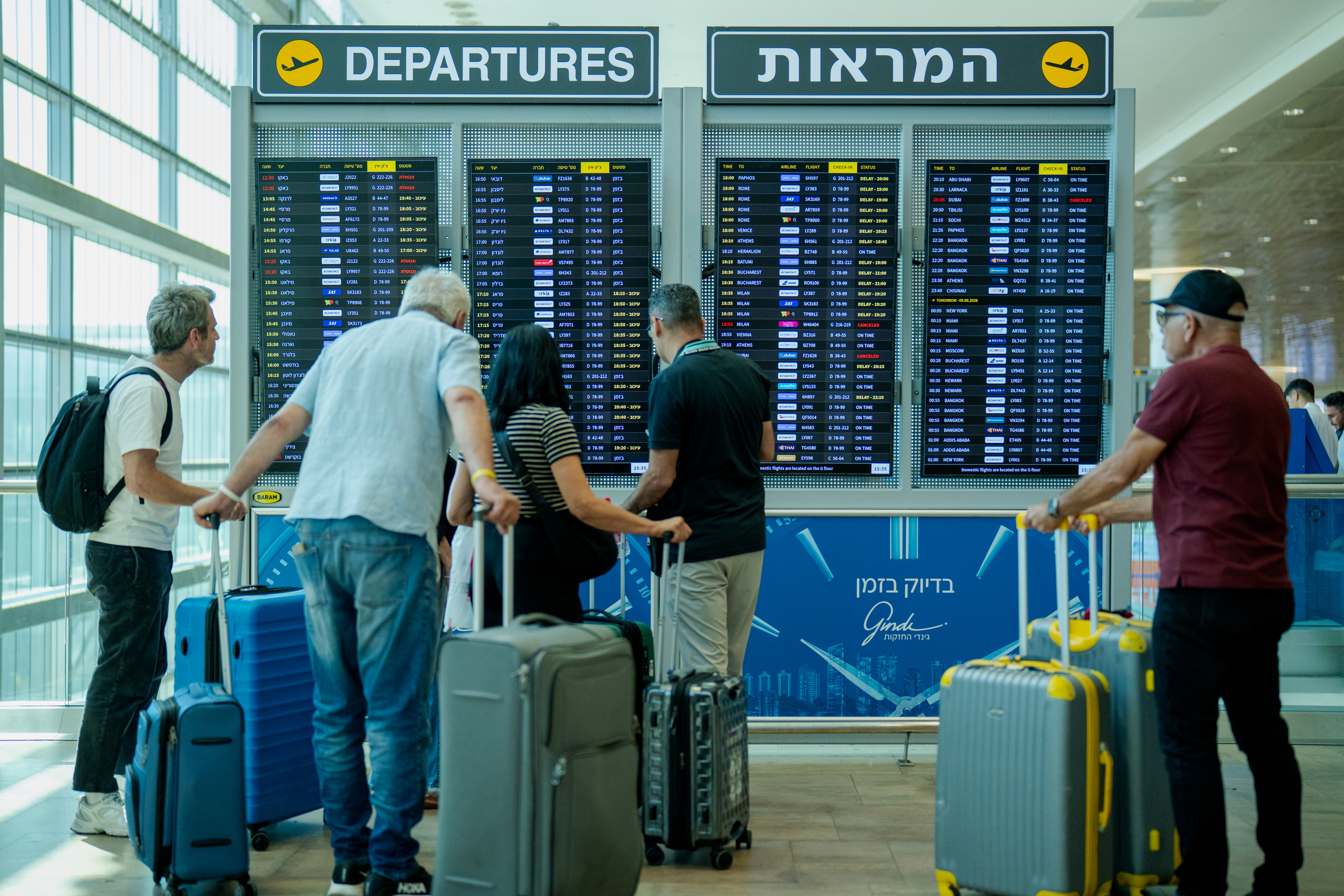 TEL AVIV, ISRAEL - JUNE 8: Passengers check the departure board inside the Departure Hall at Ben Gurion International Airport on June 8, 2026, in Tel Aviv, Israel. Aviation officials kept the country's main gateway open following a wave of early morning Iranian missile strikes. Iran and Israel are once again trading attacks after Iran launched a series of missiles at Israel on June 7th, for the first time in two months, apparently in response to Israel's strikes against Hezbollah in the Beirut suburbs. The latest exchange comes as the United States has pressed Israel to refrain from attacks in Lebanon as it tries to negotiate a regional ceasefire with Iran. (Photo by Erik Marmor/Getty Images)