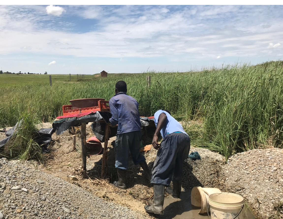 Illegal chrome miners work at a mining site near Rustenburg in South Africa’s North West province [Tsitsi Bhobo/Al Jazeera]