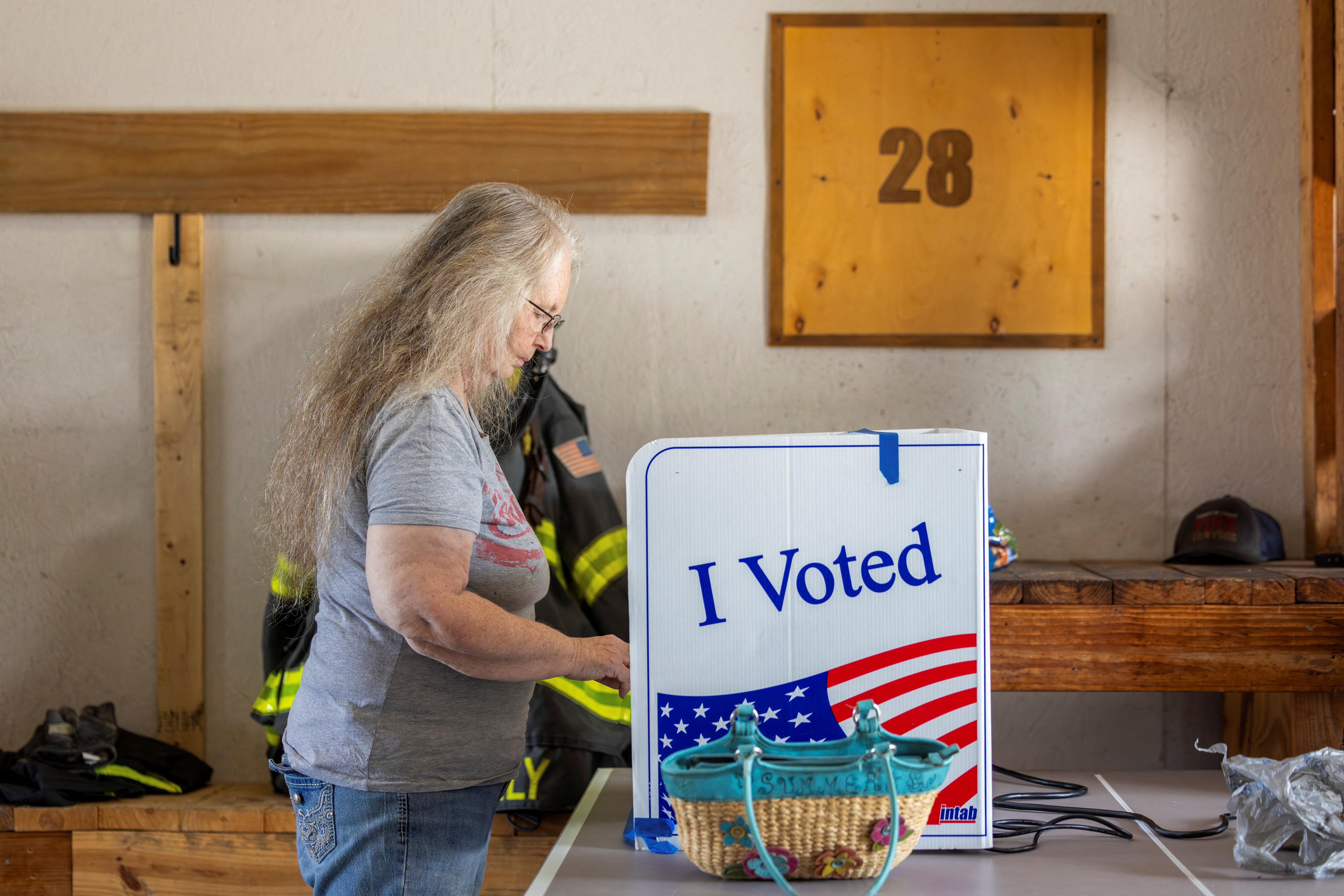 A voter casts her ballot at a polling station in a Republican primary runoff between U.S. Senator Darline Graham (R-SC) and U.S. Representative Ralph Norman (R-SC) for the U.S. Senate seat, in Lexington, Lexington County, South Carolina, U.S., August 25, 2026. REUTERS/Sam Wolfe