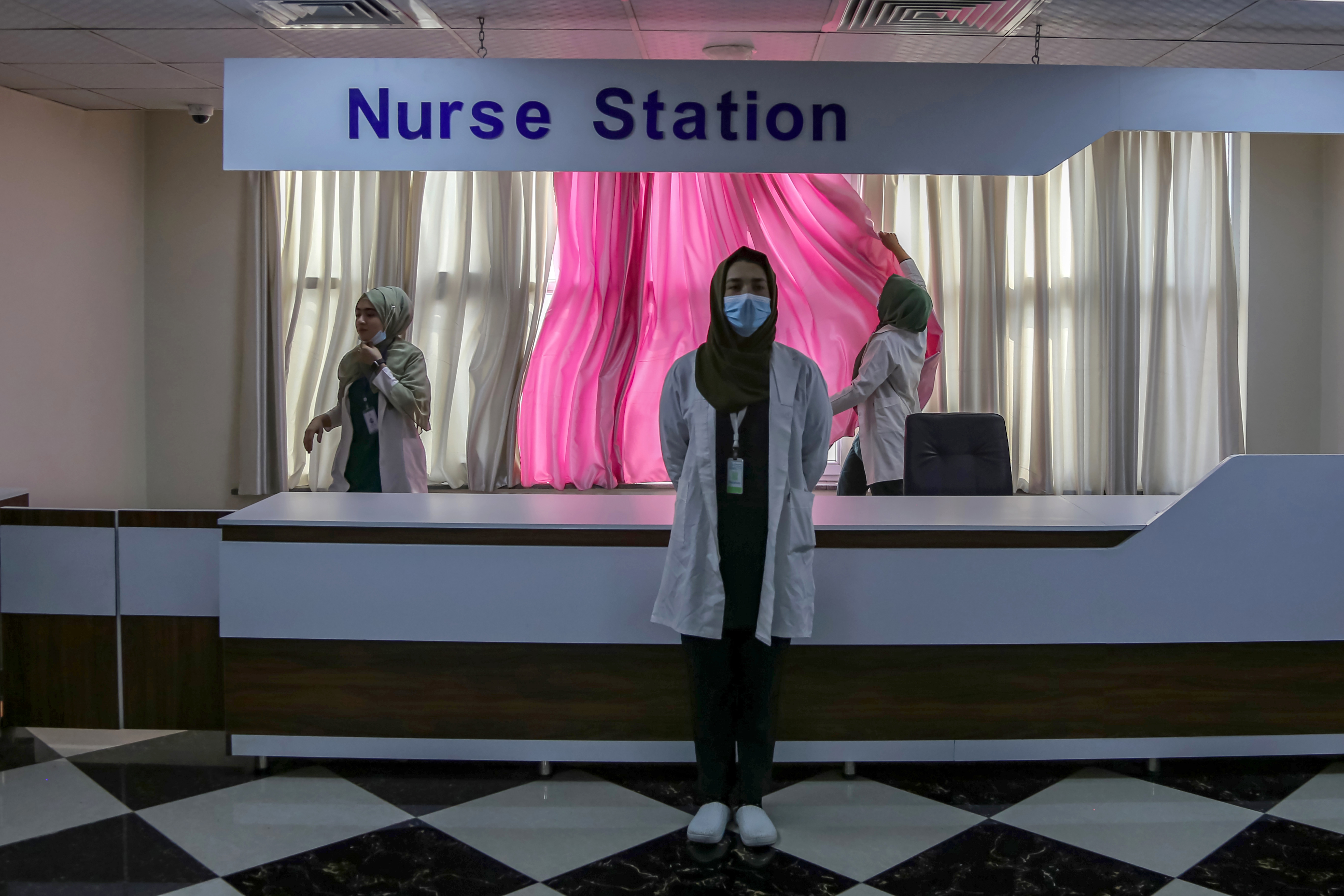 epa11802040 (L-R) Afghan nursing and midwifery students Roya Siddiqui, Tahmina Azami and Madina Azami practice nursing and midwifery at a private hospital in Kabul, Afghanistan, 24 December 2024 (issued 02 January 2025). Afghan students associated with medical studies faced a devastating setback when the Taliban imposed a ban on female medical education, leading to their dismissal from private schools and hospitals where they are practicing as residents to gain practical experience. The Taliban's recent ban on midwifery and nursing studies in Afghanistan has significantly limited women's access to professional training and jeopardized their healthcare, as cultural norms forbid male doctors from treating them. With around 35,000 women studying medicine before the ban, the closure of these programs poses significant risks to women's health in a country with one of the highest maternal mortality rates globally. EPA/SAMIULLAH POPAL ATTENTION: This Image is part of a PHOTO SET
