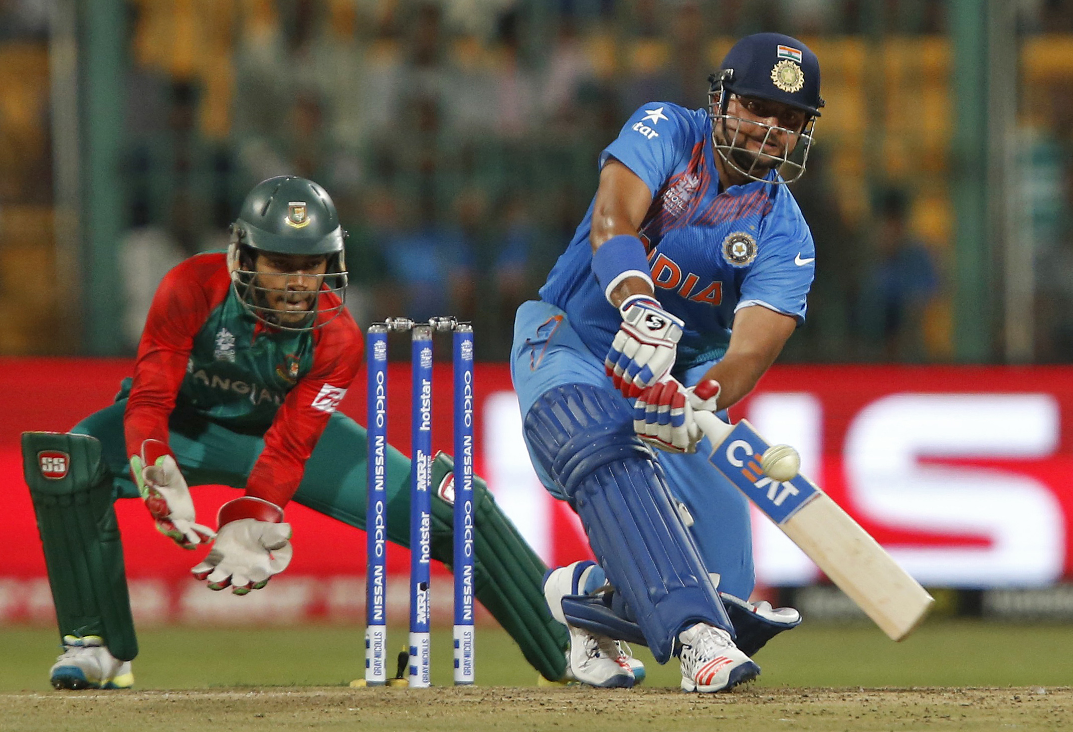 Indian cricketer, seen here batting in the blue uniform, was questioned by law enforcement agencies over endorsements for online betting companies [FILE: Danish Siddiqui/ Reuters]