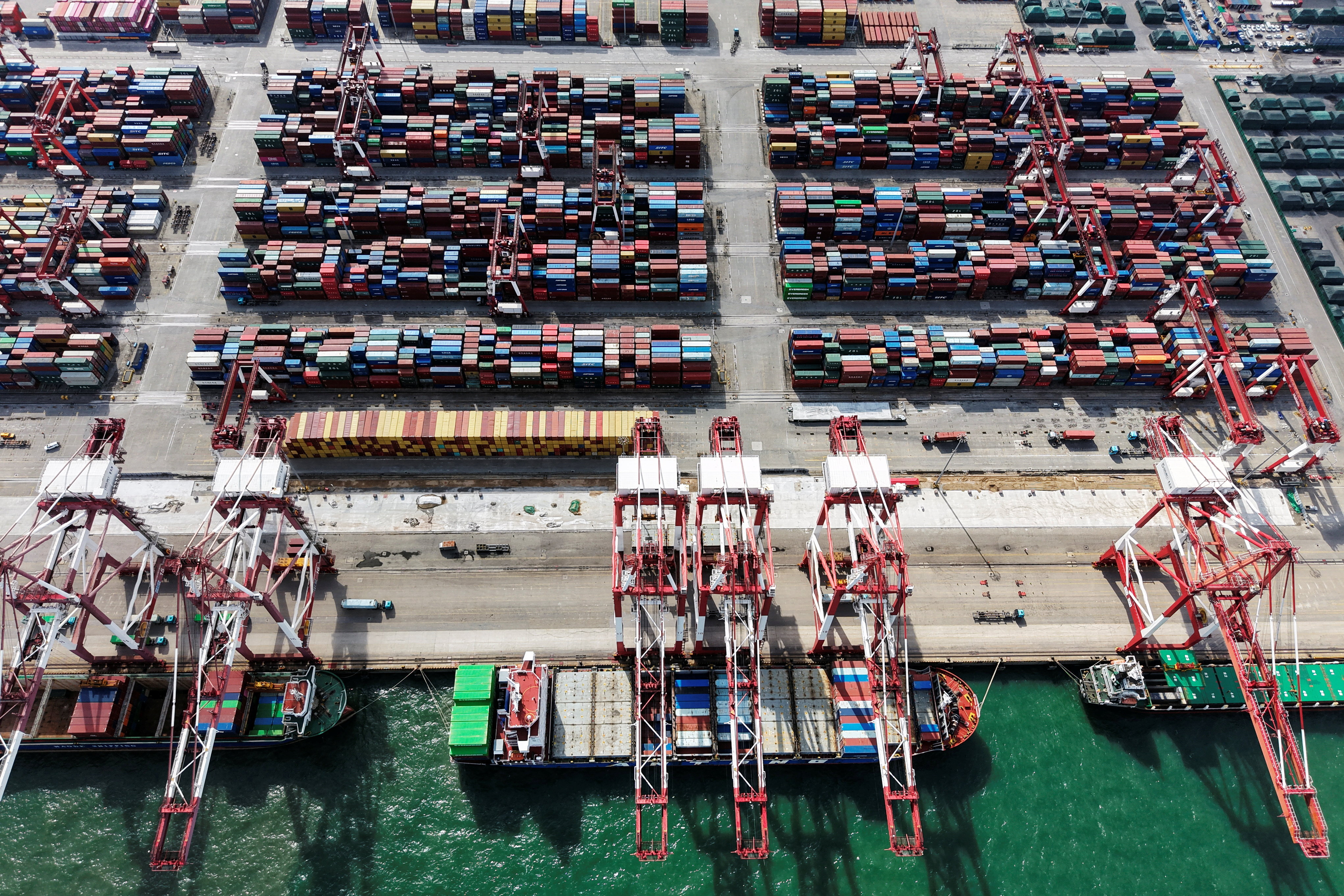 A drone view shows ships and containers at the port in Qingdao