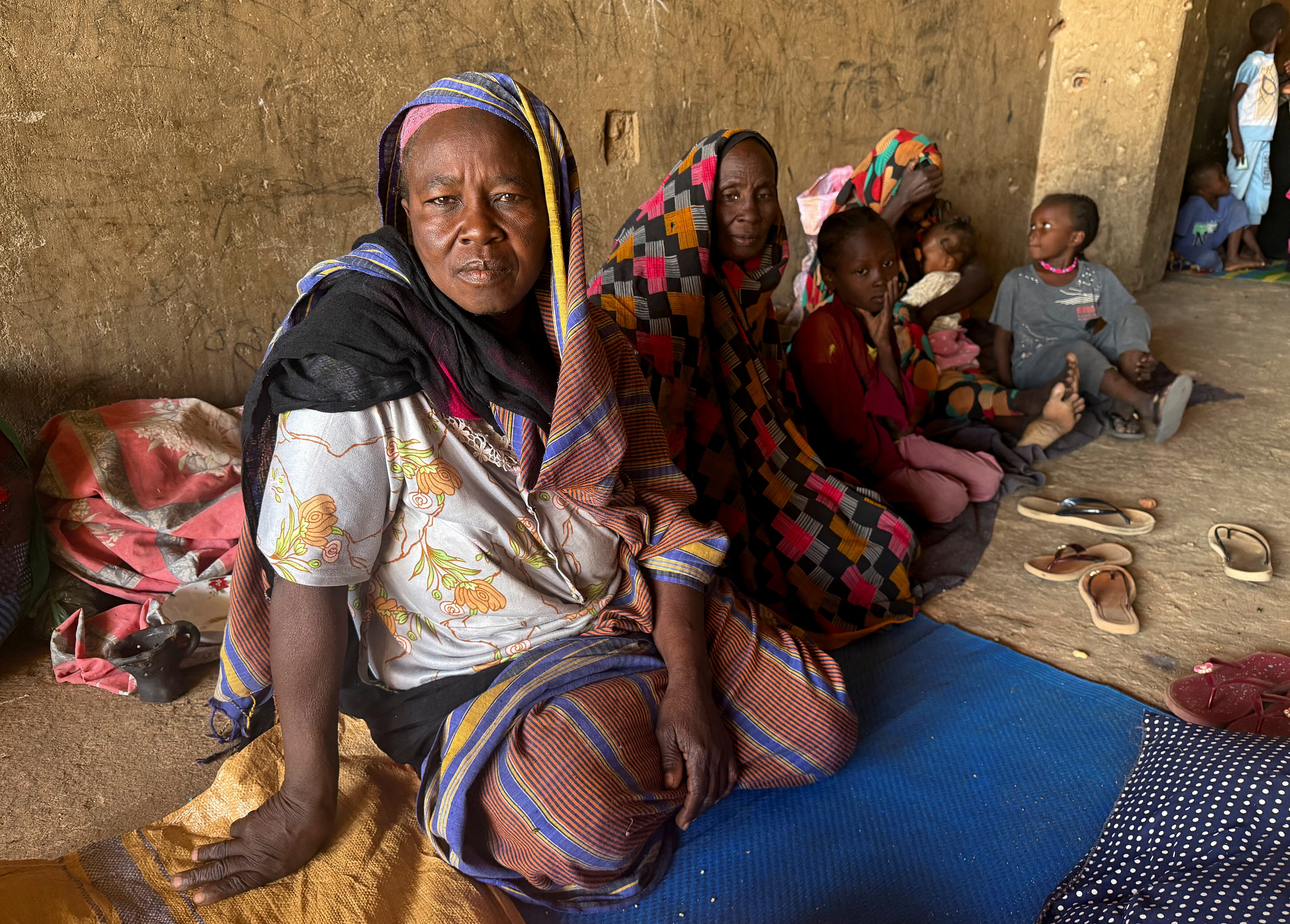 Displaced women from South Kordofan sit on the ground in El Obeid, North Kordofan State, Sudan [File: El Tayeb Siddig/Reuters]
