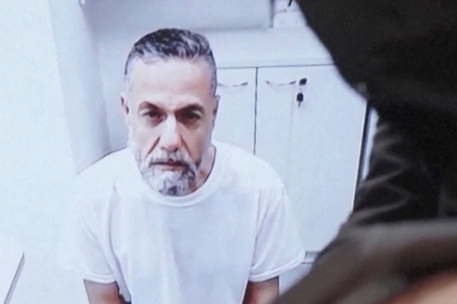 Palestinian doctor Hussam Abu Safiya, who was captured by the Israeli military in Gaza in late 2024 and still held in detention, appears via video link at the Israeli Supreme Court hearing in Jerusalem, June 10, 2026. REUTERS TV via REUTERS