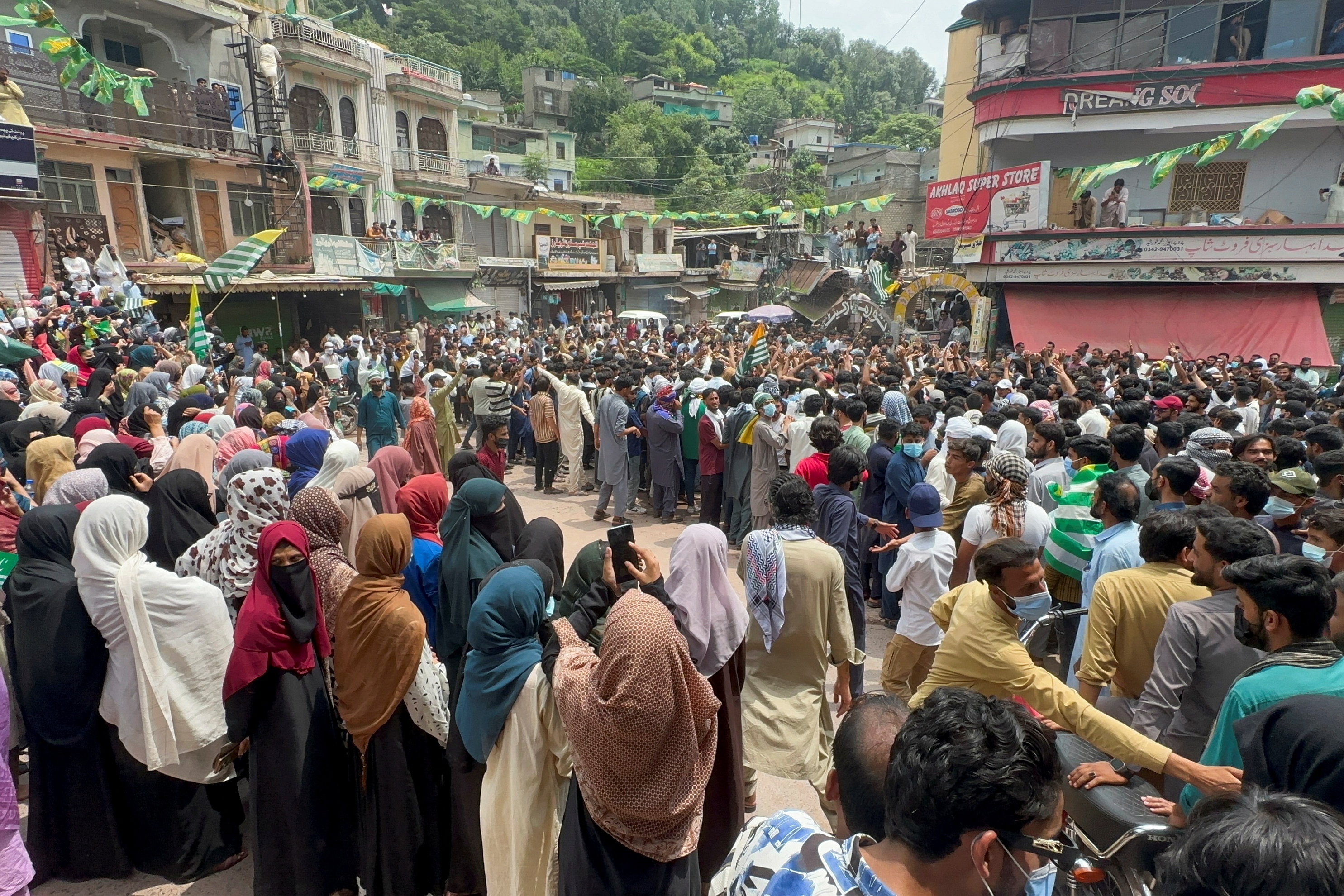 People gather in support of a protest by the banned Joint Awami Action Committee (JAAC), an alliance of civil society groups, during a demonstration in Kotli, Pakistani Kashmir, July 30, 2026. Picture taken with a mobile phone. REUTERS/Stringer