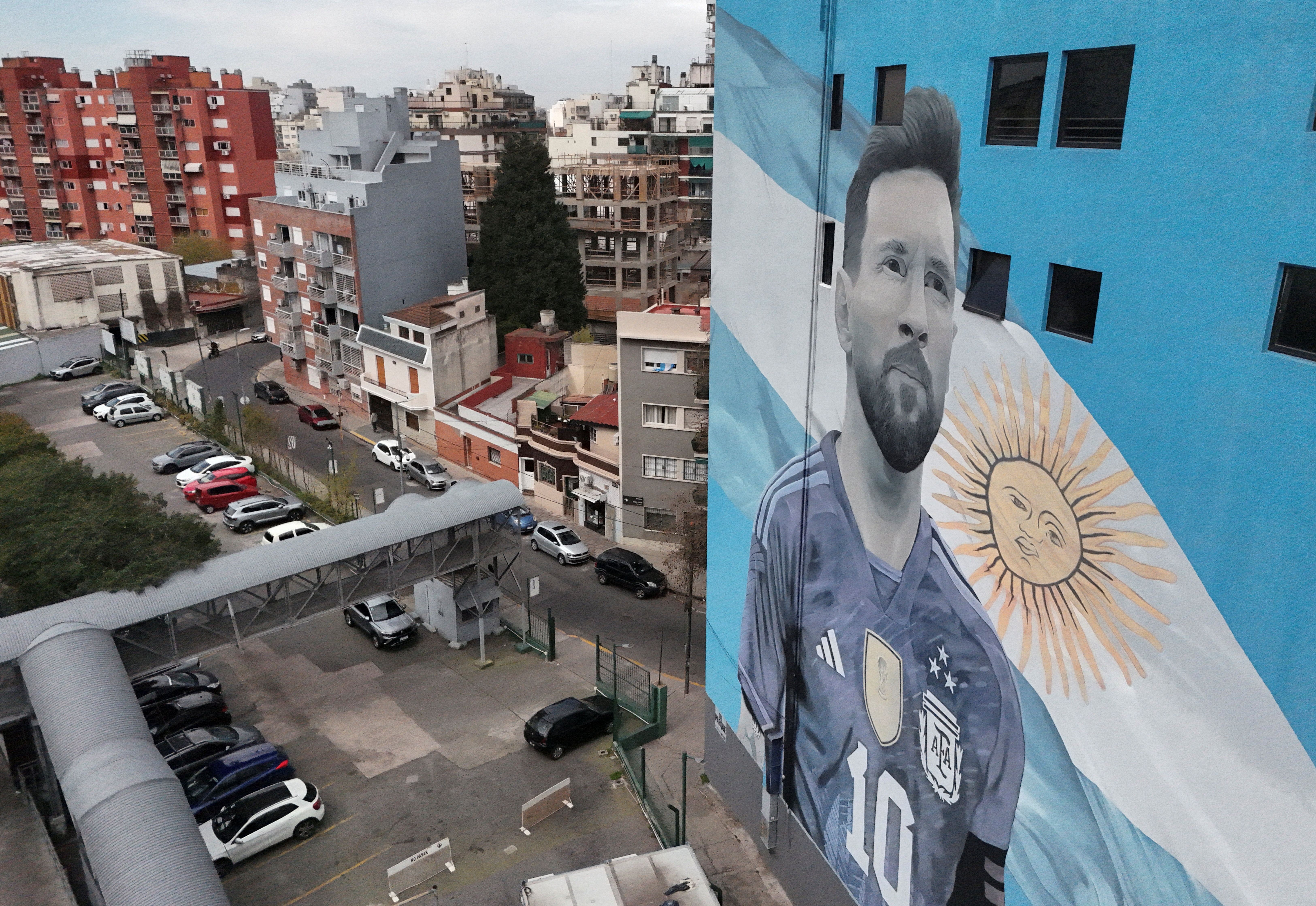 A drone view shows one of the giant murals of Argentinian football legend Lionel Messi, on the day he announced his retirement from the national team, at the Villa del Parque train station, in Buenos Aires, Argentina, August 31, 2026