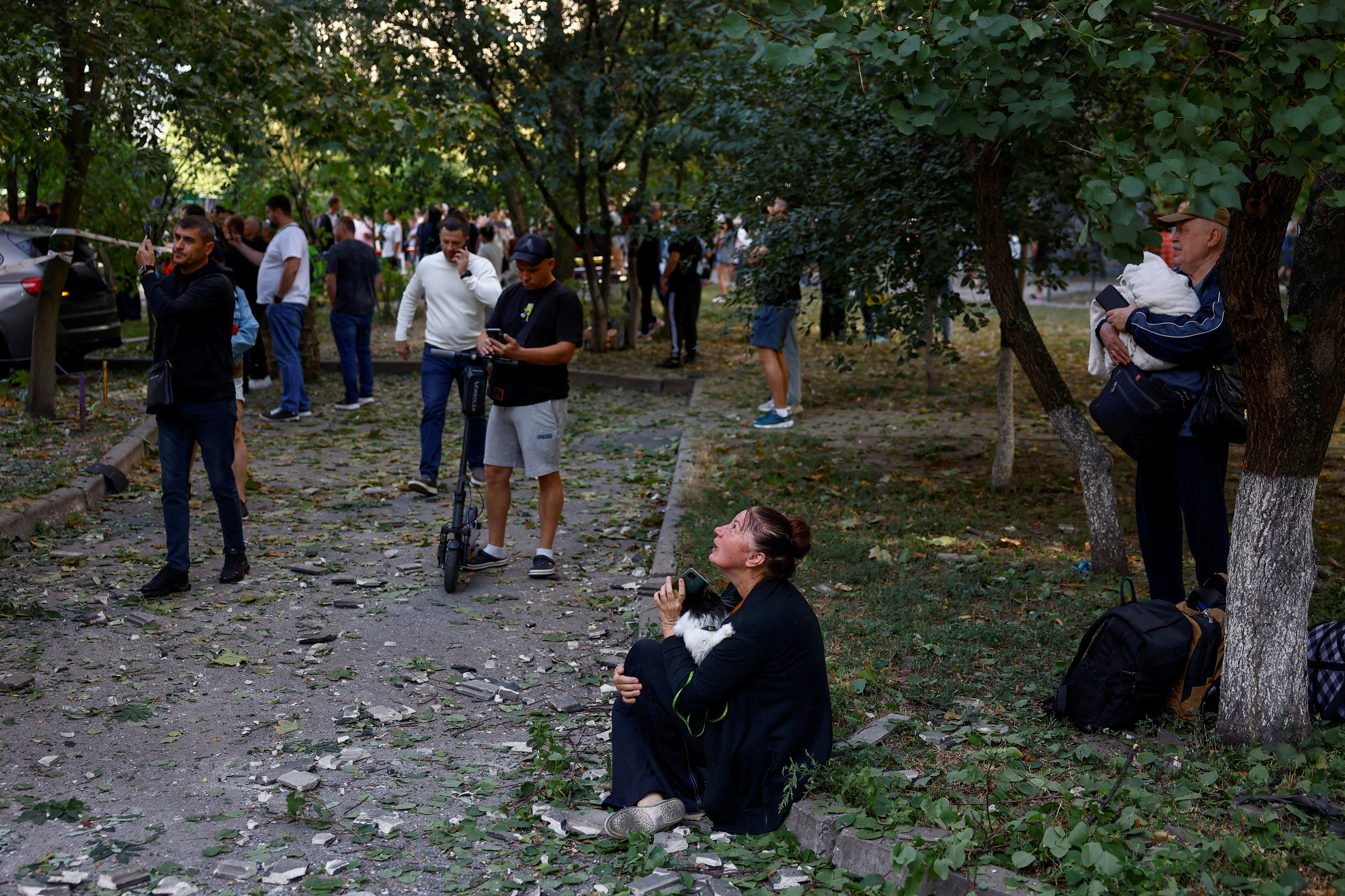 A woman looks at her apartment building hit by a Russian drone strike, amid Russia's attack on Ukraine, in Kyiv, Ukraine September 9, 2026. REUTERS/Valentyn Ogirenko TPX IMAGES OF THE DAY