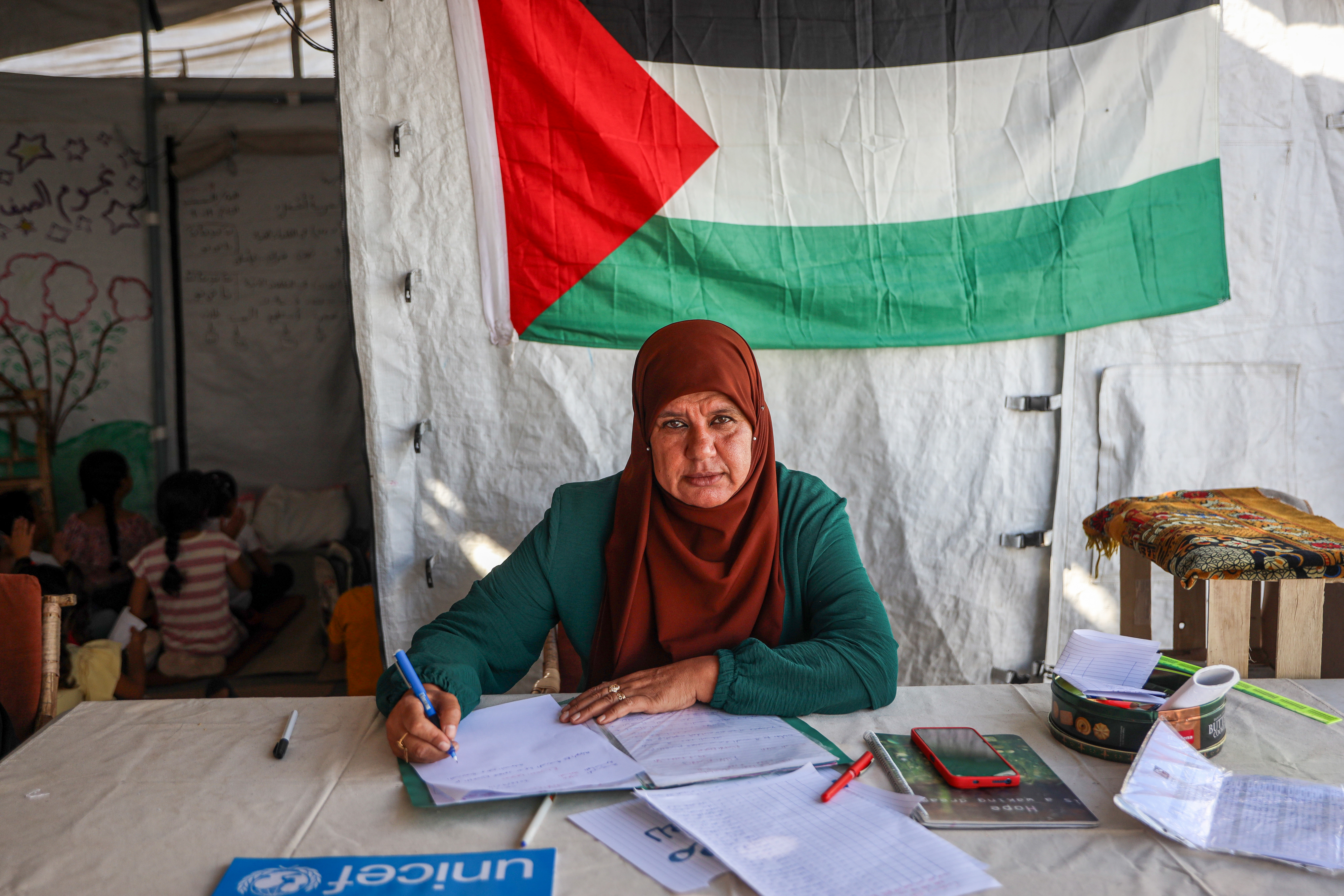 Inaam Al-Batreekhi, director of Ahbab Al-Shuja'iya School in Gaza's port area, says the school has 300 students and urgently needs support to provide basic learning conditions [Abdelhakim Abu Riash/Al Jazeera]