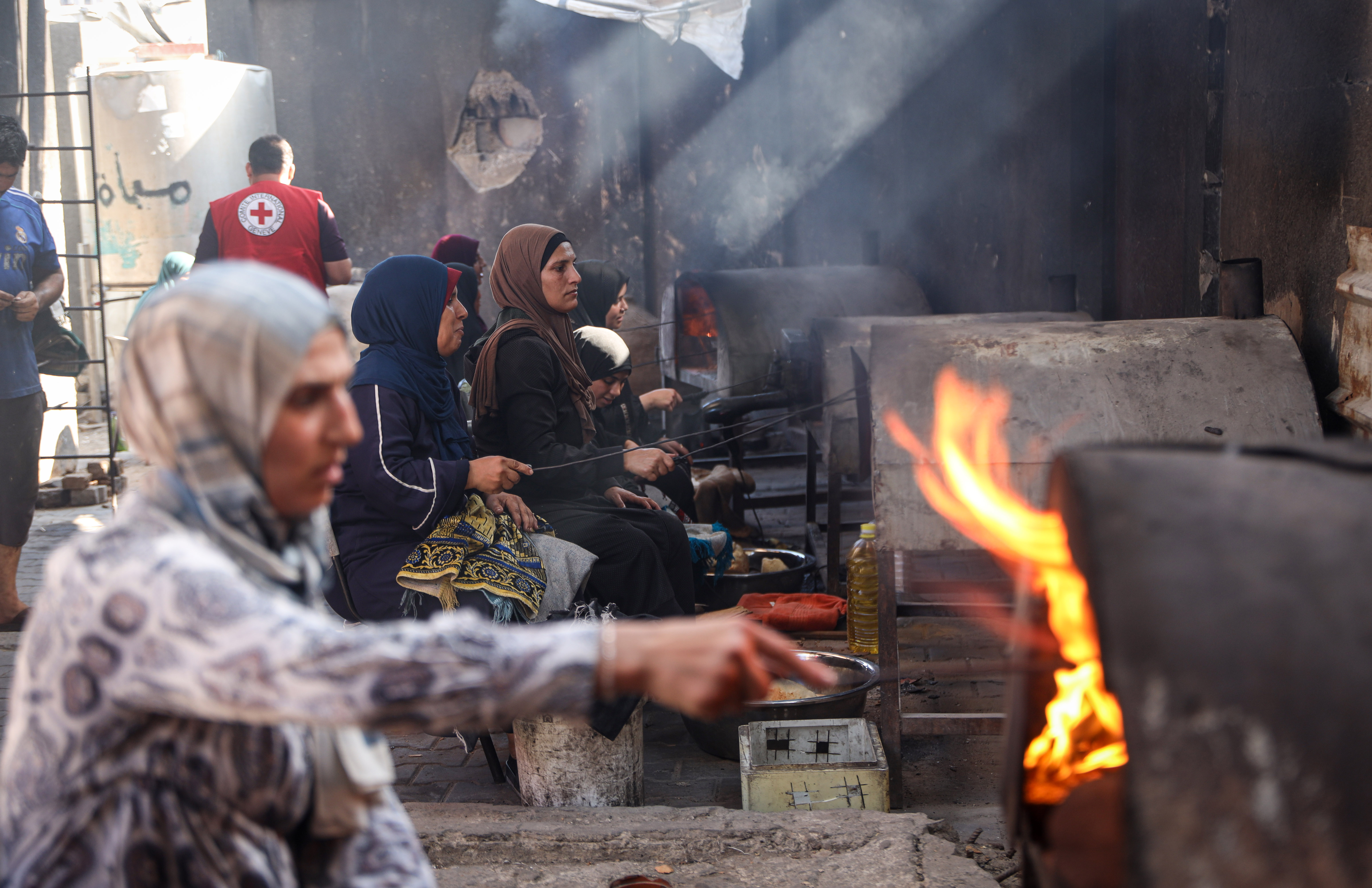 Displaced women turn to communal ovens to bake bread as the cost of cooking fuel and firewood continues to rise, sometimes costing more than the food itself