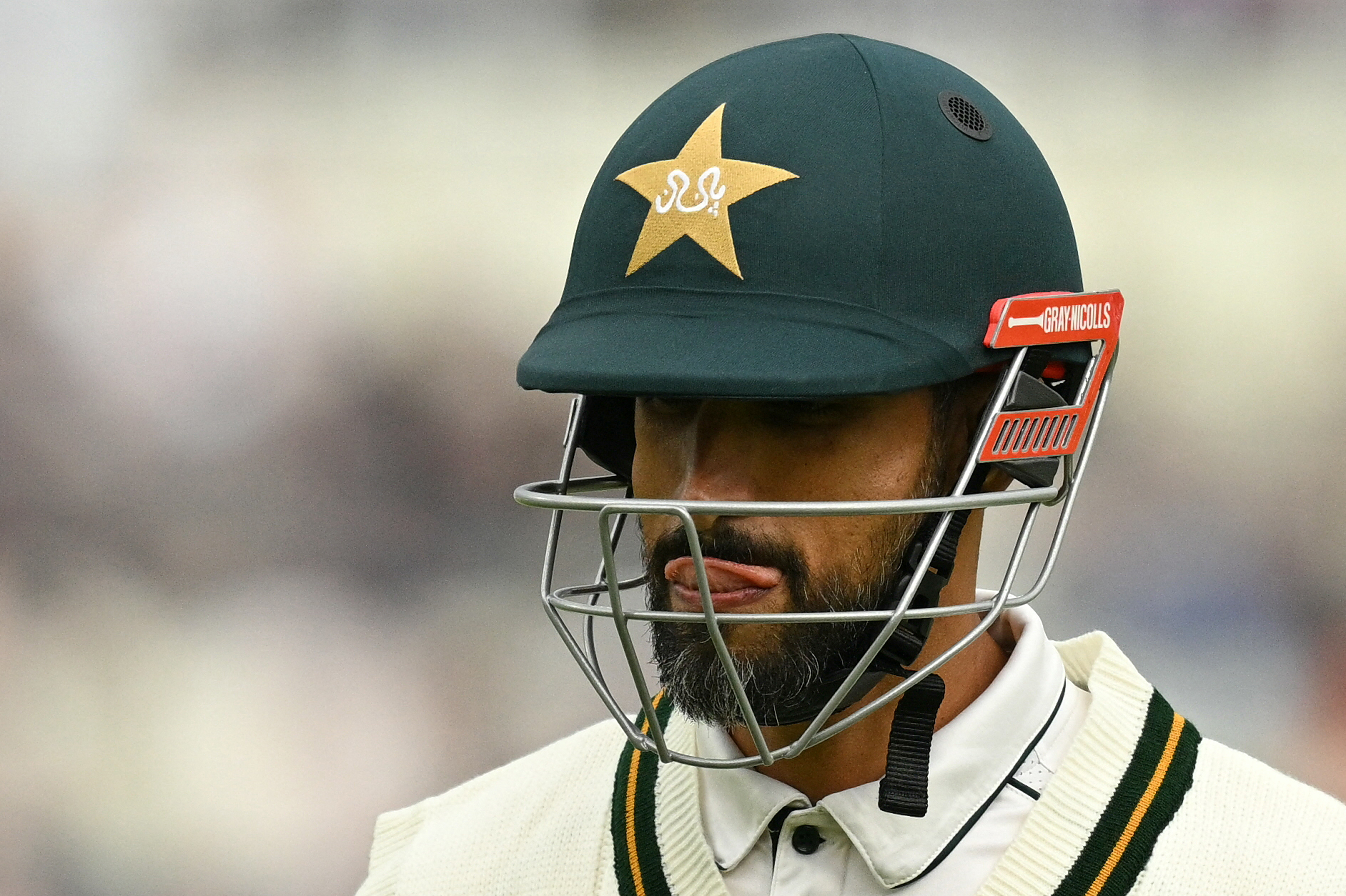 Pakistan's Shan Masood walks back to the pavilion after losing his wicket for five runs on day one of the third test match between England and Pakistan at Edgbaston cricket ground in Birmingham, central England, on September 9, 2026. (Photo by Oli SCARFF / AFP) / RESTRICTED TO EDITORIAL USE. NO ASSOCIATION WITH DIRECT COMPETITOR OF SPONSOR, PARTNER, OR SUPPLIER OF THE ECB